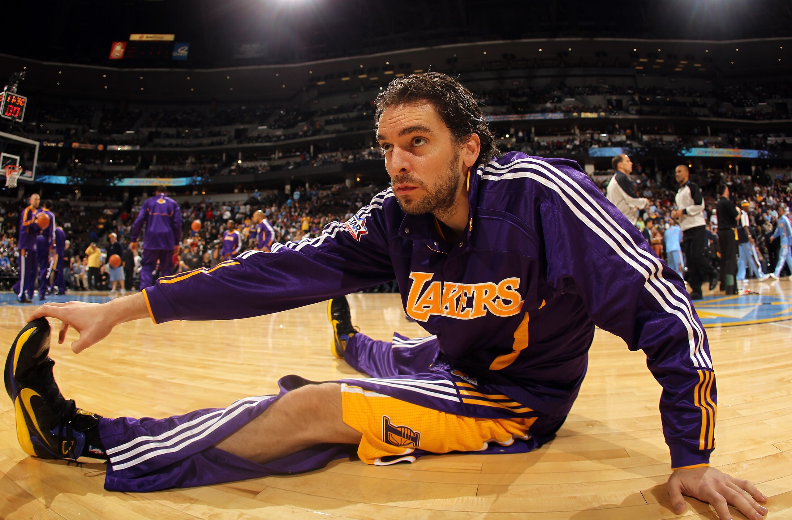 DENVER - NOVEMBER 11: Pau Gasol #16 of the Los Angeles Lakers stretches prior to facing the Denver Nuggets at the Pepsi Center on November 11, 2010 in Denver, Colorado. The Nuggets defeated the Lakers 118-112. NOTE TO USER: User expressly acknowledges a DENVER - NOVEMBER 11: Pau Gasol #16 of the Los Angeles Lakers stretches prior to facing the Denver Nuggets at the Pepsi Center on November 11, 2010 in Denver, Colorado. The Nuggets defeated the Lakers 118-112. NOTE TO USER: User expressly acknowledges a