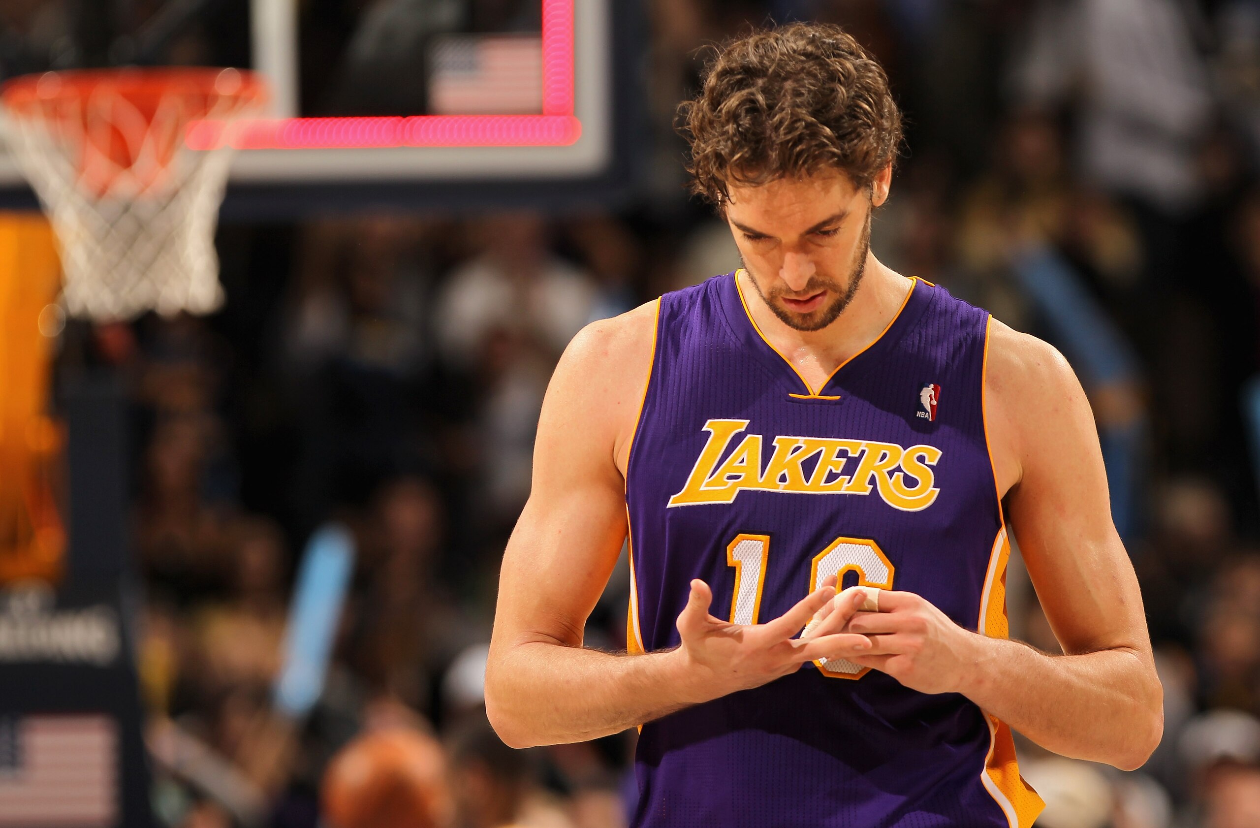 DENVER - NOVEMBER 11: Pau Gasol #16 of the Los Angeles Lakers leaves the court after the Lakers were defeated by the Denver Nuggets at the Pepsi Center on November 11, 2010 in Denver, Colorado. The Nuggets defeated the Lakers 118-112. NOTE TO USER: User DENVER - NOVEMBER 11: Pau Gasol #16 of the Los Angeles Lakers leaves the court after the Lakers were defeated by the Denver Nuggets at the Pepsi Center on November 11, 2010 in Denver, Colorado. The Nuggets defeated the Lakers 118-112. NOTE TO USER: User