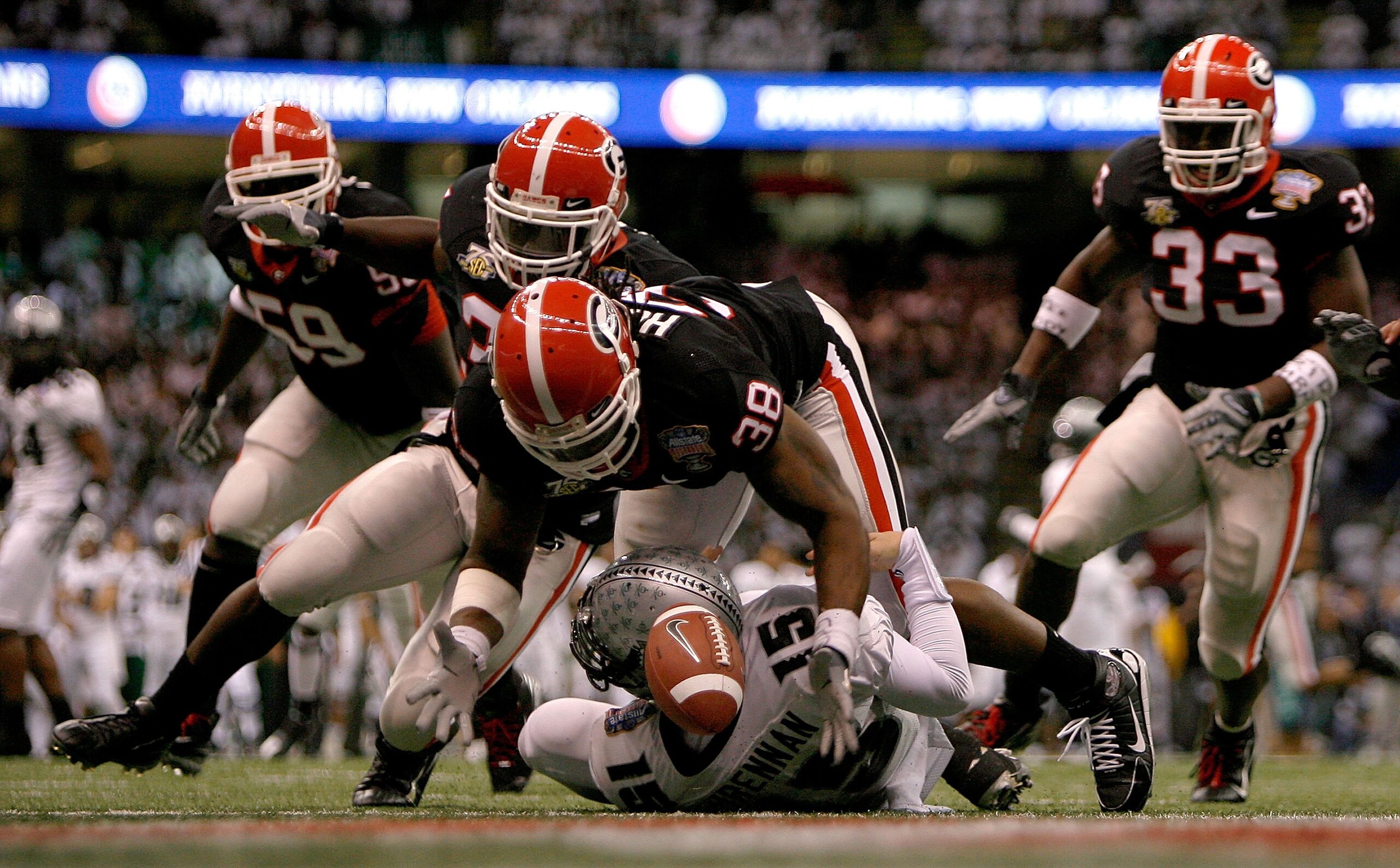 NEW ORLEANS - JANUARY 01:  Marcus Howard #38 of the Georgia Bulldogs recovers a fumble by Colt Brennan #15 of the Hawai'i Warriors, in the endzone for a touchdown in the third quarter during the Allstate Sugar Bowl at the Louisiana Superdome on January 1,
