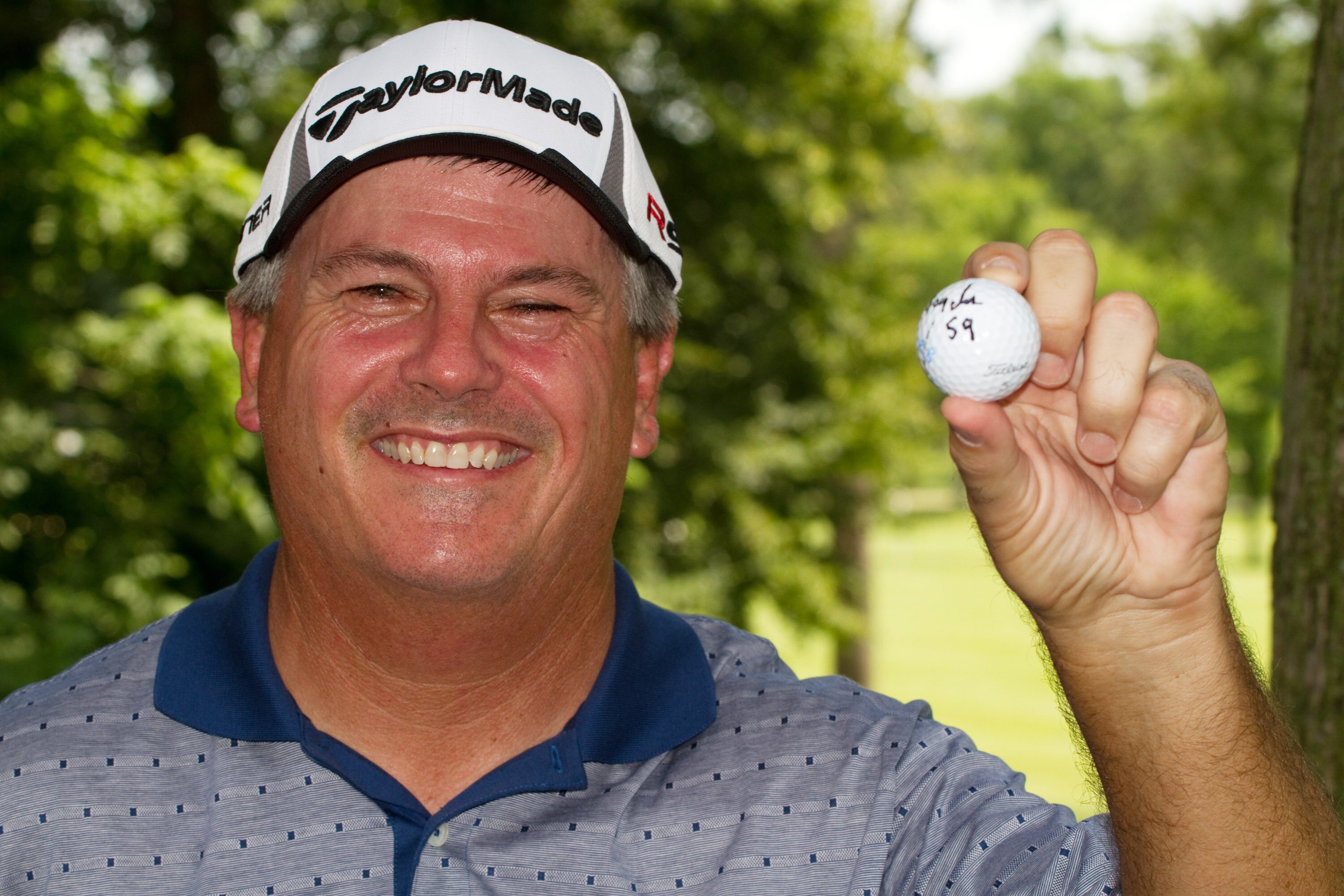SILVIS, IL - JULY 8: Paul Goydos poses with the ball he used on the front nine to shoot a 59 in the first round of the John Deere Classic at TPC Deere Run on July 8, 2010 in Silvis, Illinois. (Photo by Darren Carroll/Getty Images)