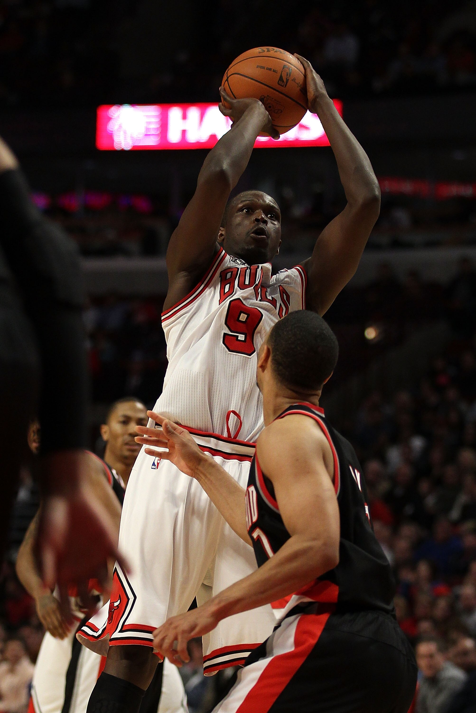 CHICAGO - NOVEMBER 01: Loul Deng #9 of the Chicago Bulls puts up a shot over Brandon Roy #7 of the Portland Trail Blazers on his way to a game-high 40 points at the United Center on November 1, 2010 in Chicago, Illinois. The Bulls defeated the Trail Blaze