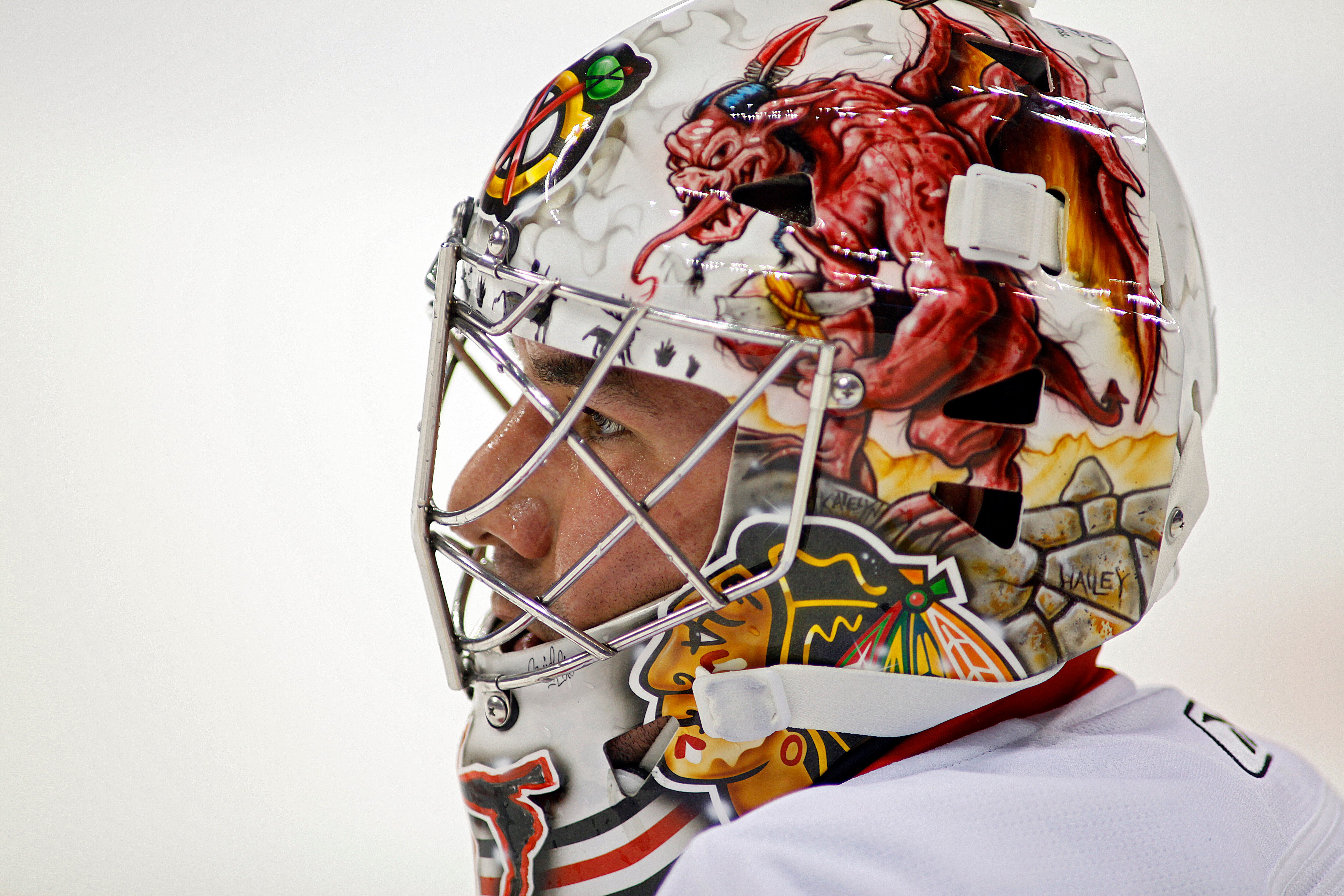 DENVER, CO - OCTOBER 7: Goaltender Marty Turco #30 of the Chicago Blackhawks watches the Colorado Avalanche players warm up as he stretches during pregame warmups at the Pepsi Center on October 7, 2010 in Denver, Colorado. (Photo by Marc Piscotty/Getty Im