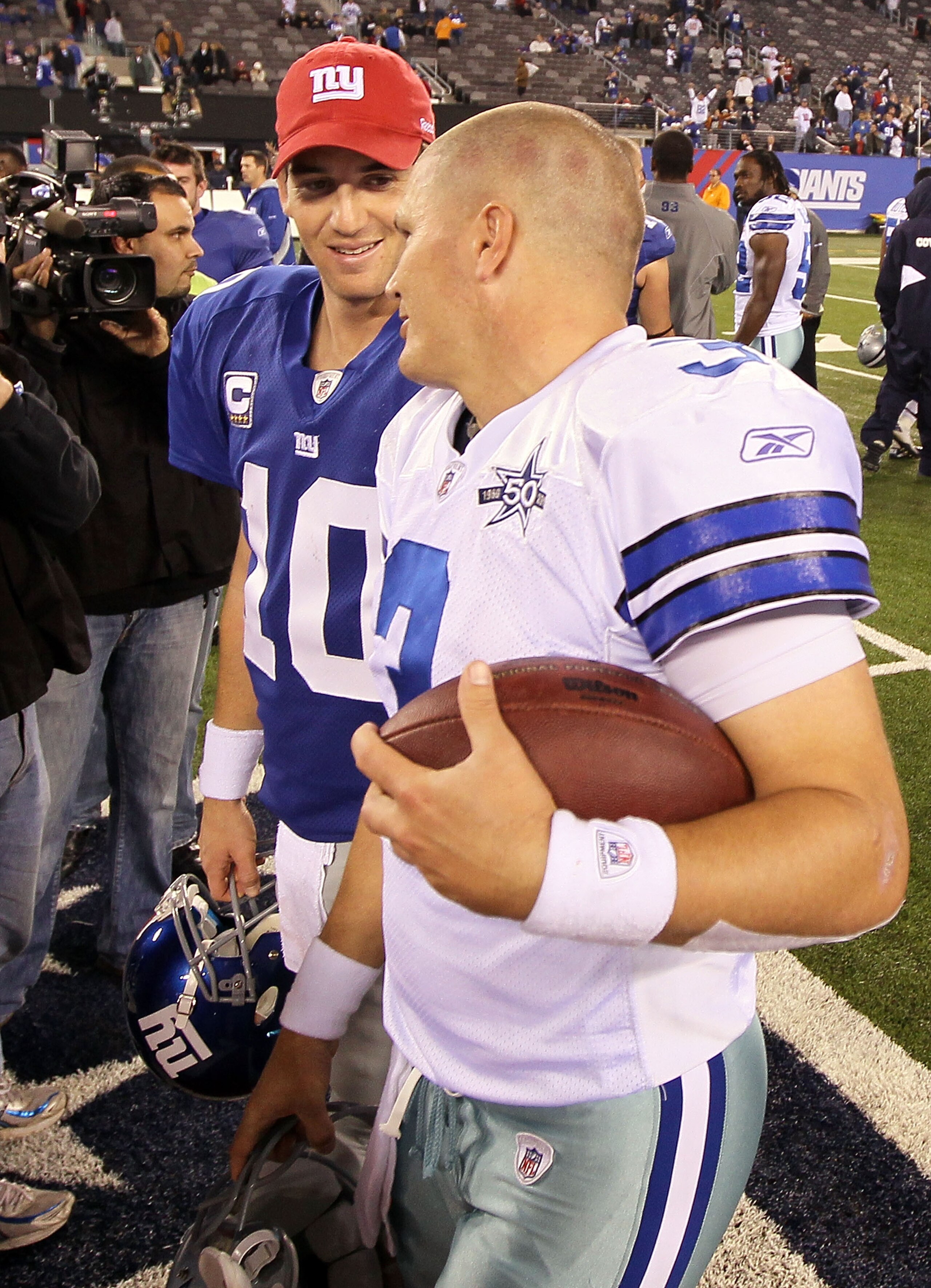 EAST RUTHERFORD, NJ - NOVEMBER 14: Jon Kitna #3 of the Dallas Cowboys talks with Eli Manning #10 of the New York Giants after their game on November 14, 2010 at the New Meadowlands Stadium in East Rutherford, New Jersey. The Cowboys defeated the Giants 33 EAST RUTHERFORD, NJ - NOVEMBER 14: Jon Kitna #3 of the Dallas Cowboys talks with Eli Manning #10 of the New York Giants after their game on November 14, 2010 at the New Meadowlands Stadium in East Rutherford, New Jersey. The Cowboys defeated the Giants 33
