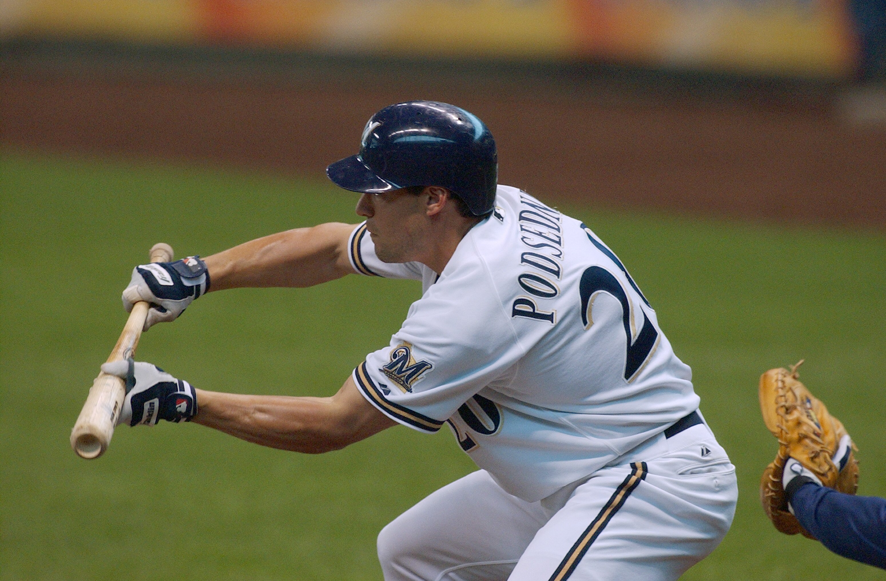 MILWAUKEE - JUNE 17:  Scott Podsednik #20 of the Milwaukee Brewers bunts during the game against the Seattle Mariners on June 17, 2004 at Miller Park in Milwaukee, Wisconsin. The Mariners won 6-3.  (Photo by Jonathan Daniel/Getty Images)