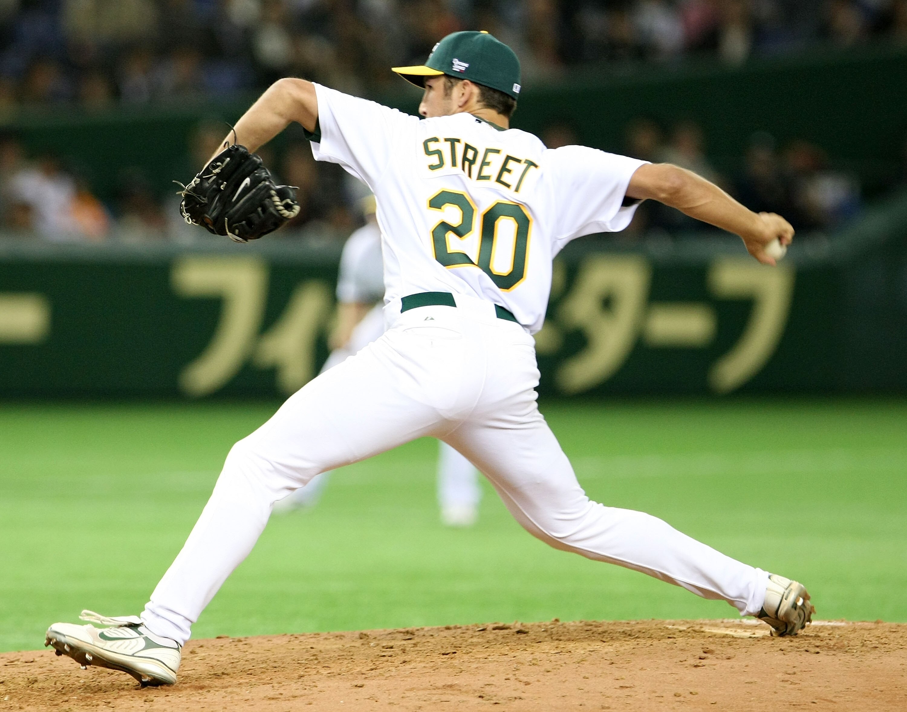 TOKYO - MARCH 22:  Pitcher Huston Street #20 of Oakland Athletics pitches during preseason friendly game between Oakland Athletics and Yomiuri Giants at Tokyo Dome on March 22, 2008 in Tokyo, Japan.  (Photo by Koichi Kamoshida/Getty Images)