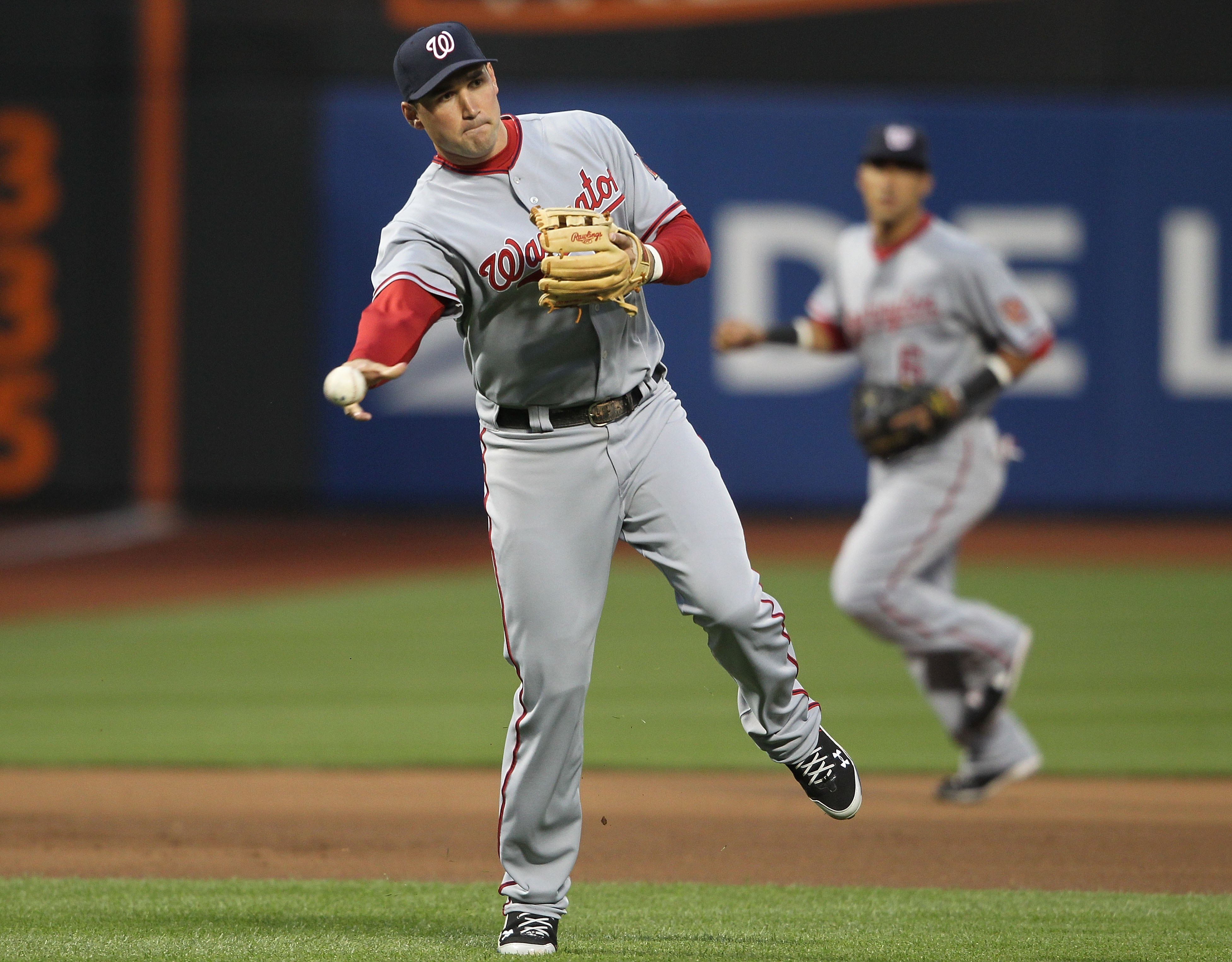 NEW YORK - MAY 11:  Ryan Zimmerman #11 of the Washington Nationals throws to first against the New York Mets at Citi Field on May 11, 2010 in the Flushing neighborhood of the Queens borough of New York City.  (Photo by Nick Laham/Getty Images)