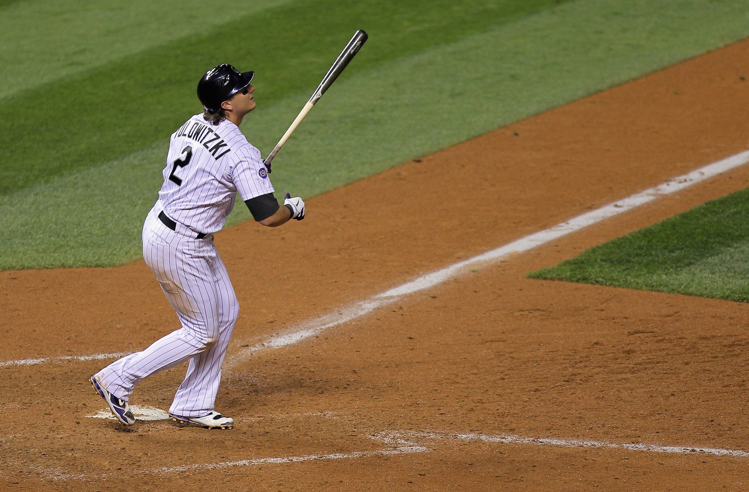 DENVER - SEPTEMBER 25:  Troy Tulowitzki #2 of the Colorado Rockies doubles to right field to score Clint Barmes and Dexter Fowler to tie the score 9-9 with the San Francisco Giants in the eighth inning at Coors Field on September 25, 2010 in Denver, Color