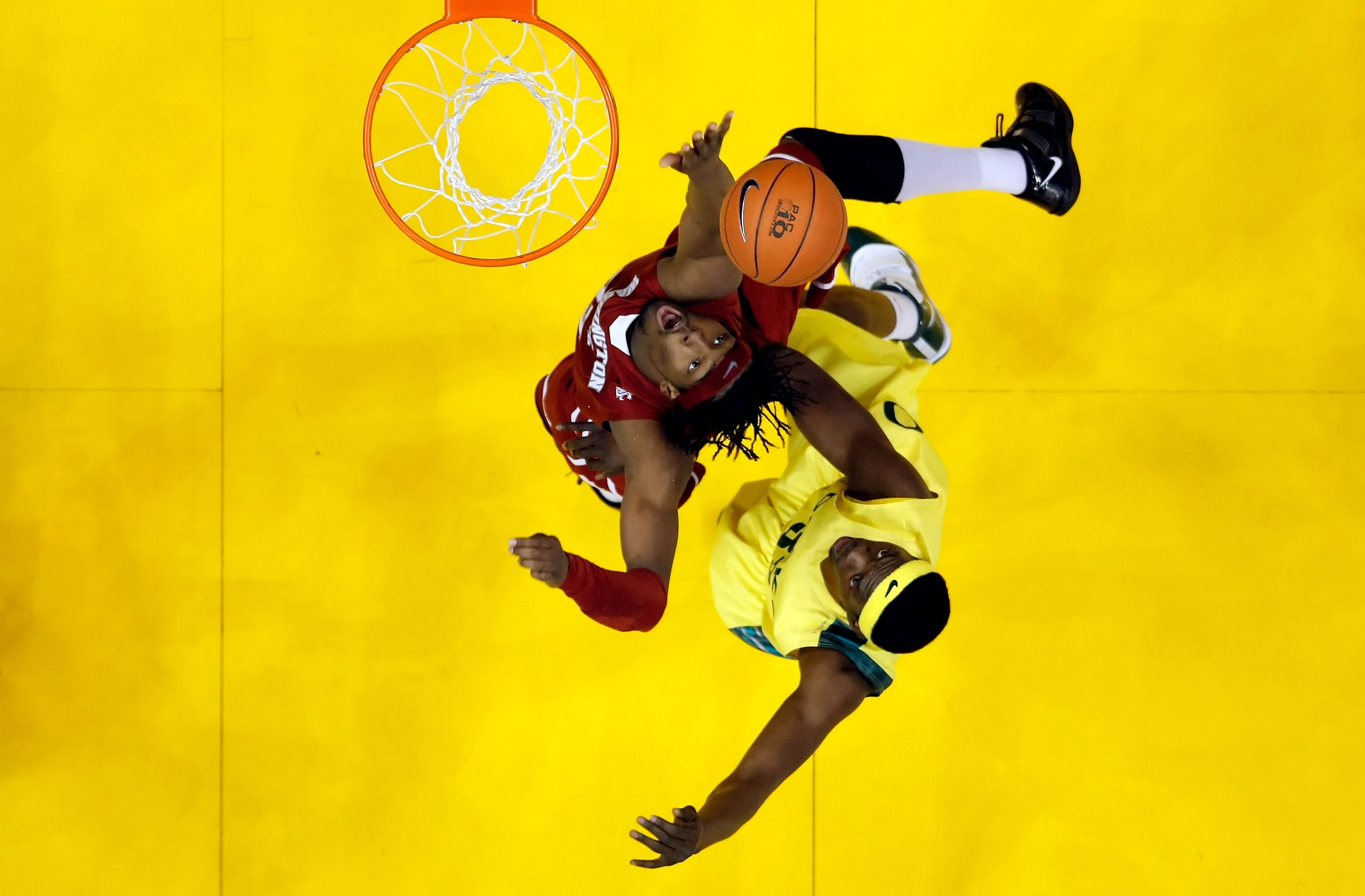 LOS ANGELES, CA - MARCH 10:  DeAngelo Casto #23 of the Washington State Cougars and Michael Dunigan #33 of the Oregon Ducks fight for a rebound during the first round of the Pac-10 Basketball Tournament at Staples Center on March 10, 2010 in Los Angeles,