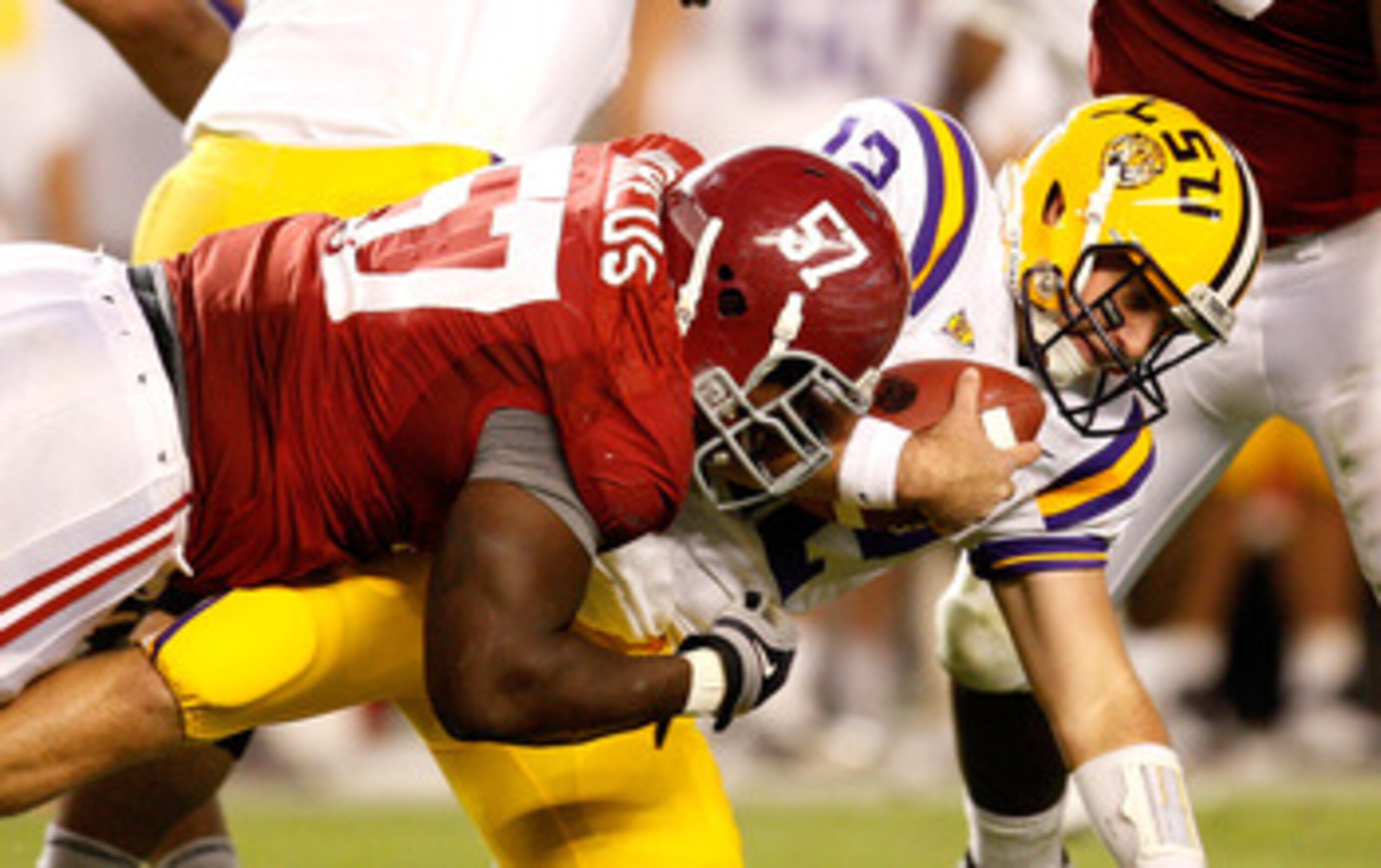 TUSCALOOSA, AL - NOVEMBER 07:  Marcell Dareus #57 of the Alabama Crimson Tide sacks quarterback Jarrett Lee #12 of the Louisiana State University Tigers at Bryant-Denny Stadium on November 7, 2009 in Tuscaloosa, Alabama.  (Photo by Kevin C. Cox/Getty Imag
