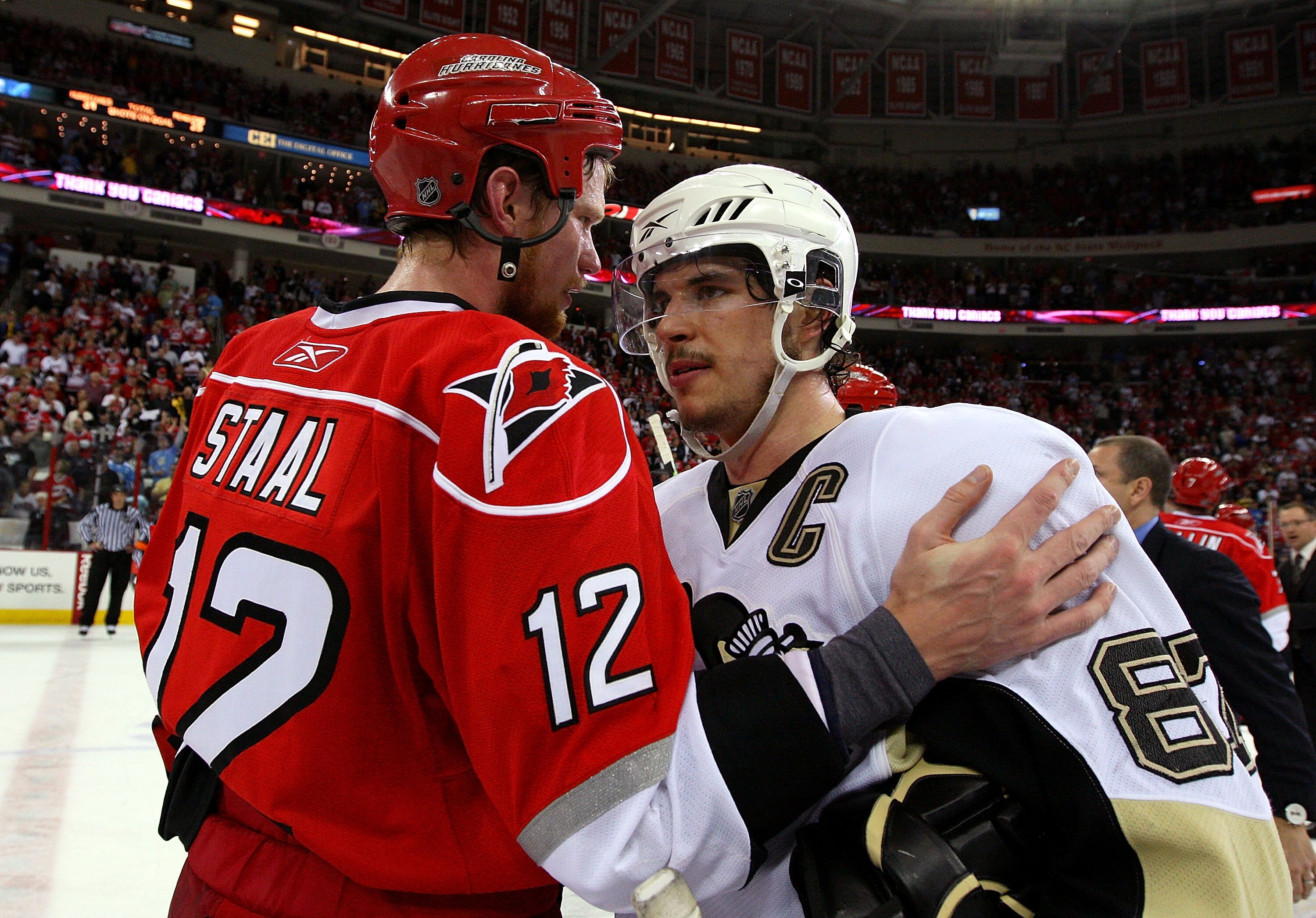 RALEIGH, NC - MAY 26:  Sidney Crosby #87 of the Pittsburgh Penguins is congratulated by Eric Staal #12 after their 4-1 win in Game Four of the Eastern Conference Championship Round of the 2009 Stanley Cup Playoffs at RBC Center on May 26, 2009 in Raleigh,