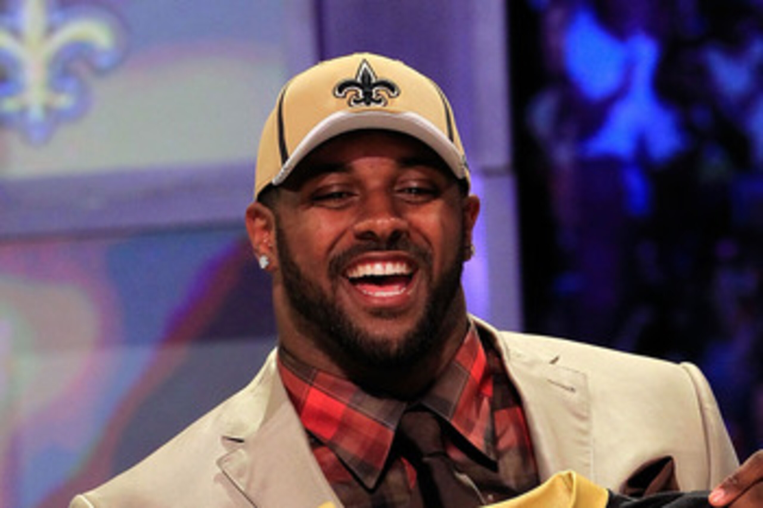 NEW YORK, NY - APRIL 28:  Cameron Jordan, #24 overall pick by the New Orleans Saints, holds up a jersey on stage during the 2011 NFL Draft at Radio City Music Hall on April 28, 2011 in New York City.  (Photo by Chris Trotman/Getty Images)
