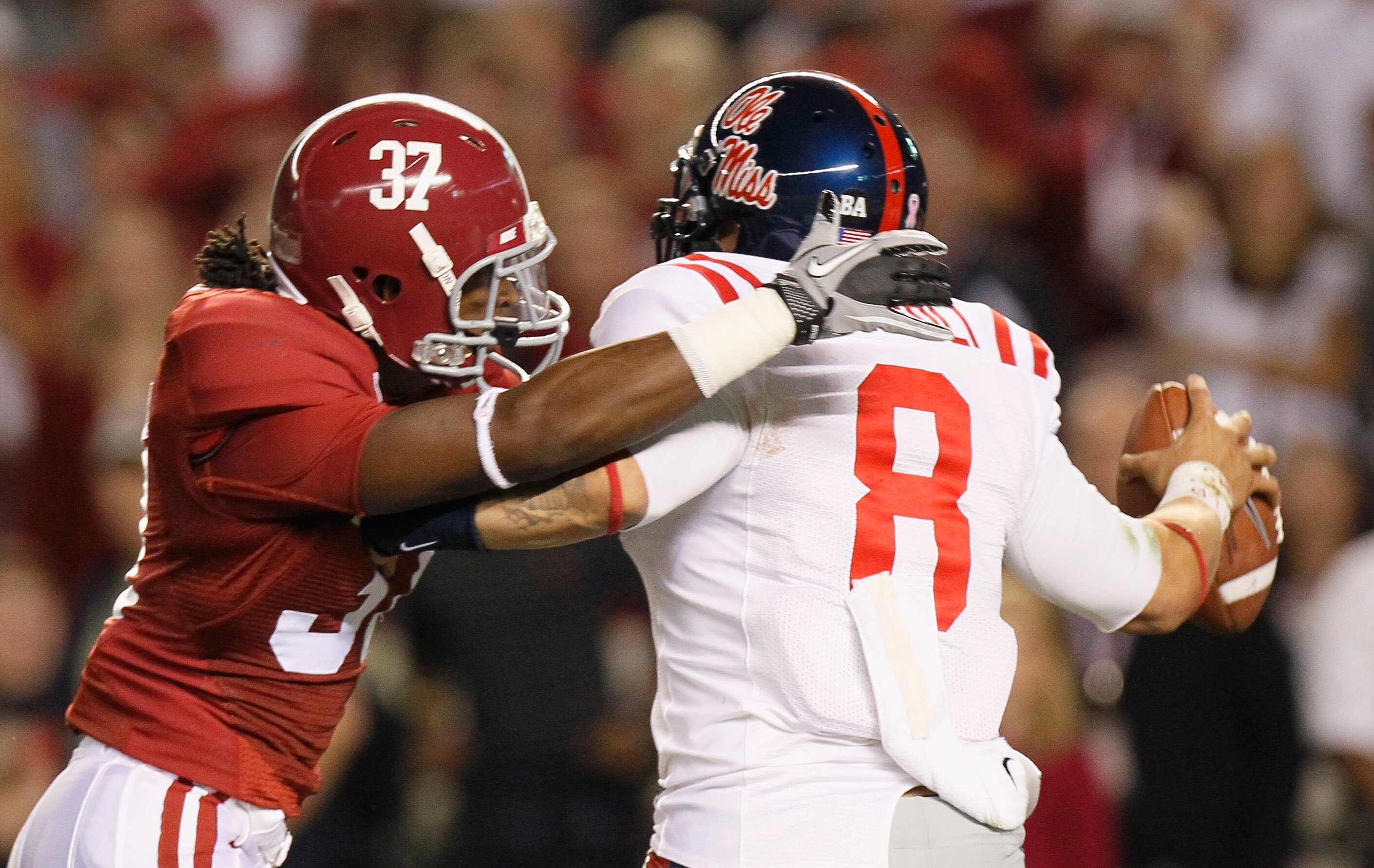 TUSCALOOSA, AL - OCTOBER 16:  Robert Lester #37 of the Alabama Crimson Tide sacks quarterback Jeremiah Masoli #8 of the Ole Miss Rebels at Bryant-Denny Stadium on October 16, 2010 in Tuscaloosa, Alabama.  (Photo by Kevin C. Cox/Getty Images)