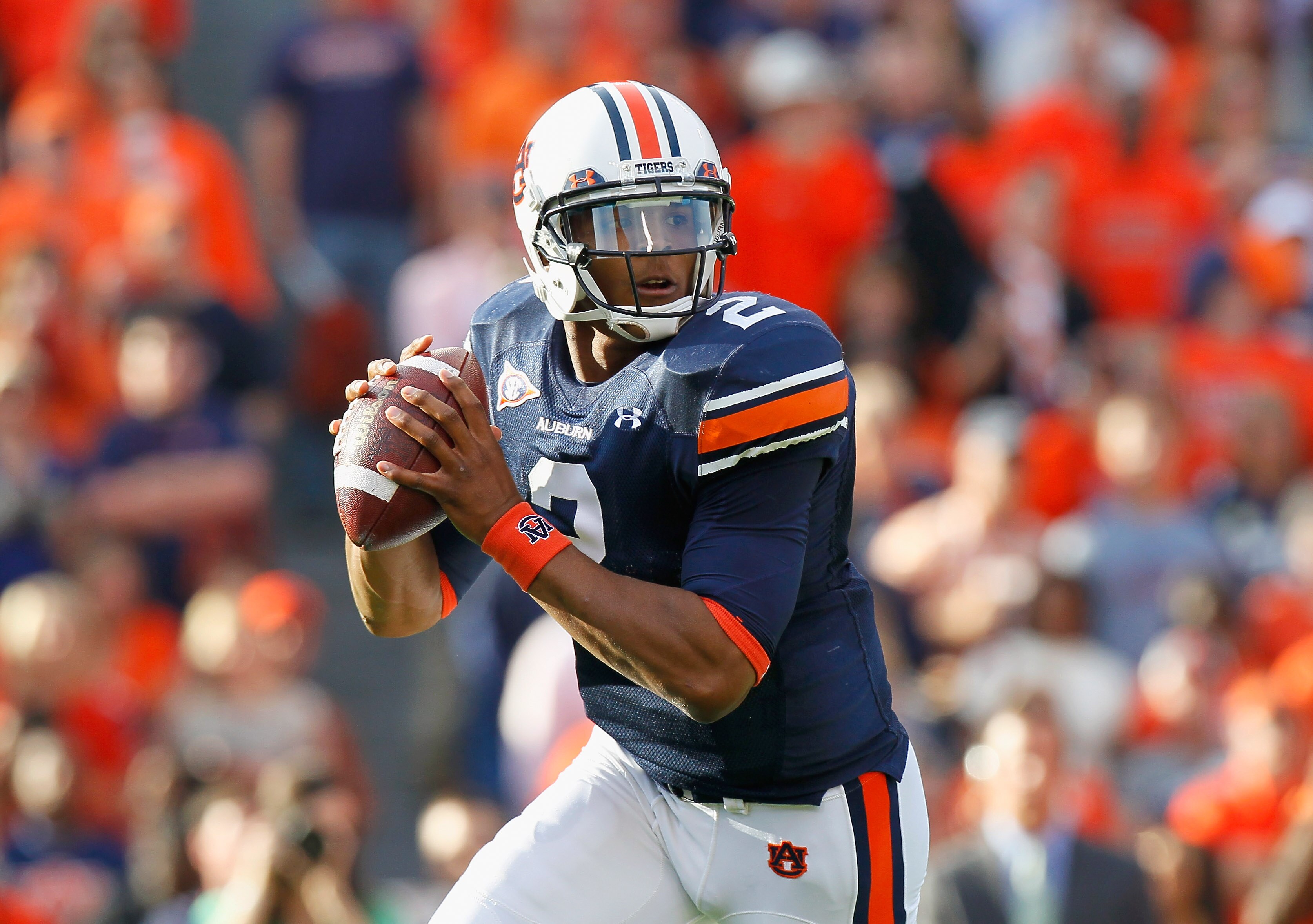 AUBURN, AL - NOVEMBER 13:  Quarterback Cameron Newton #2 of the Auburn Tigers rolls out of the pocket against the Georgia Bulldogs at Jordan-Hare Stadium on November 13, 2010 in Auburn, Alabama.  (Photo by Kevin C. Cox/Getty Images)