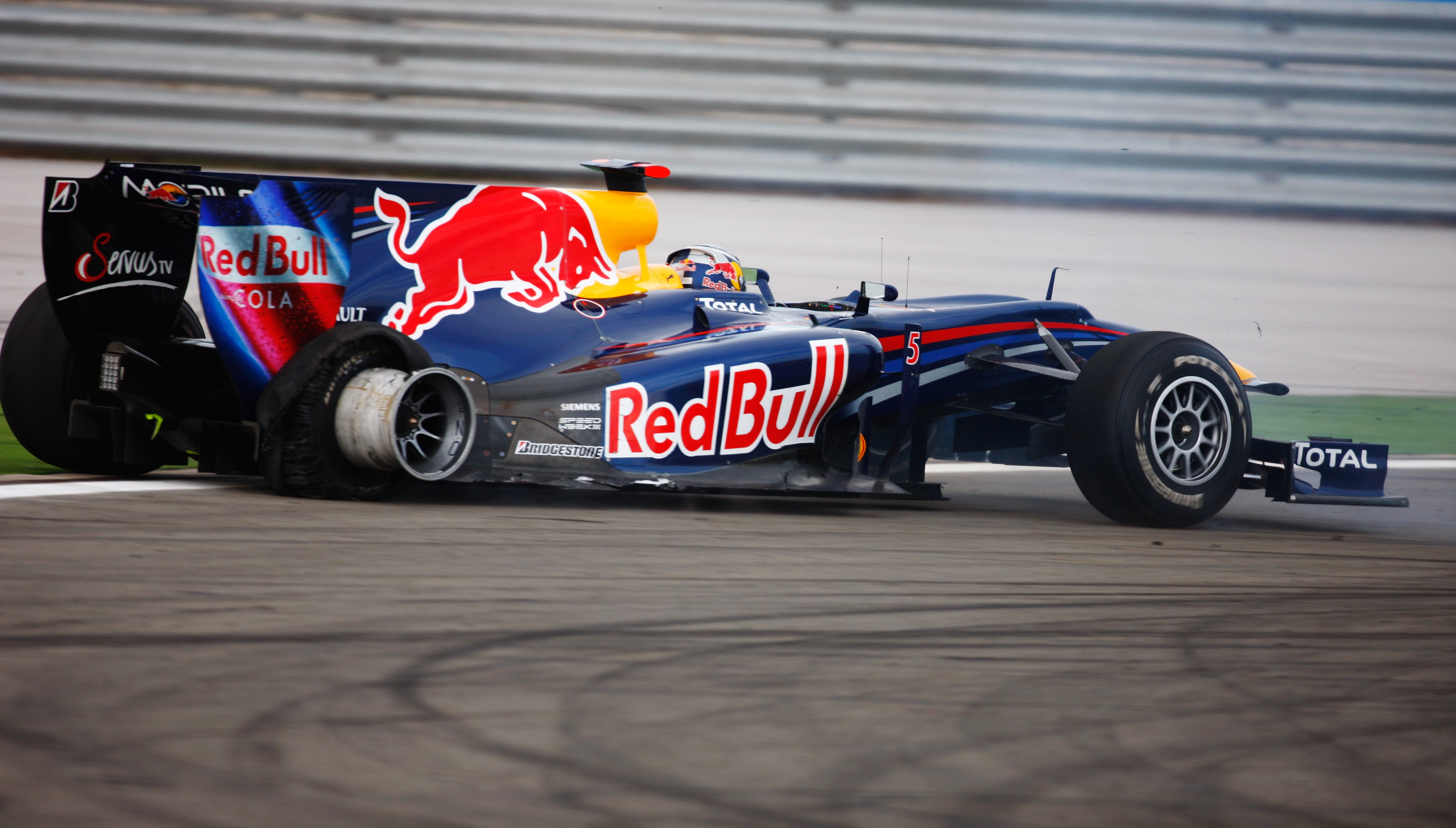 ISTANBUL, TURKEY - MAY 30:  Sebastian Vettel of Germany and Red Bull Racing crashes out after colliding with his team mate Mark Webber of Australia and Red Bull Racing during the Turkish Formula One Grand Prix at Istanbul Park on May 30, 2010, in Istanbul