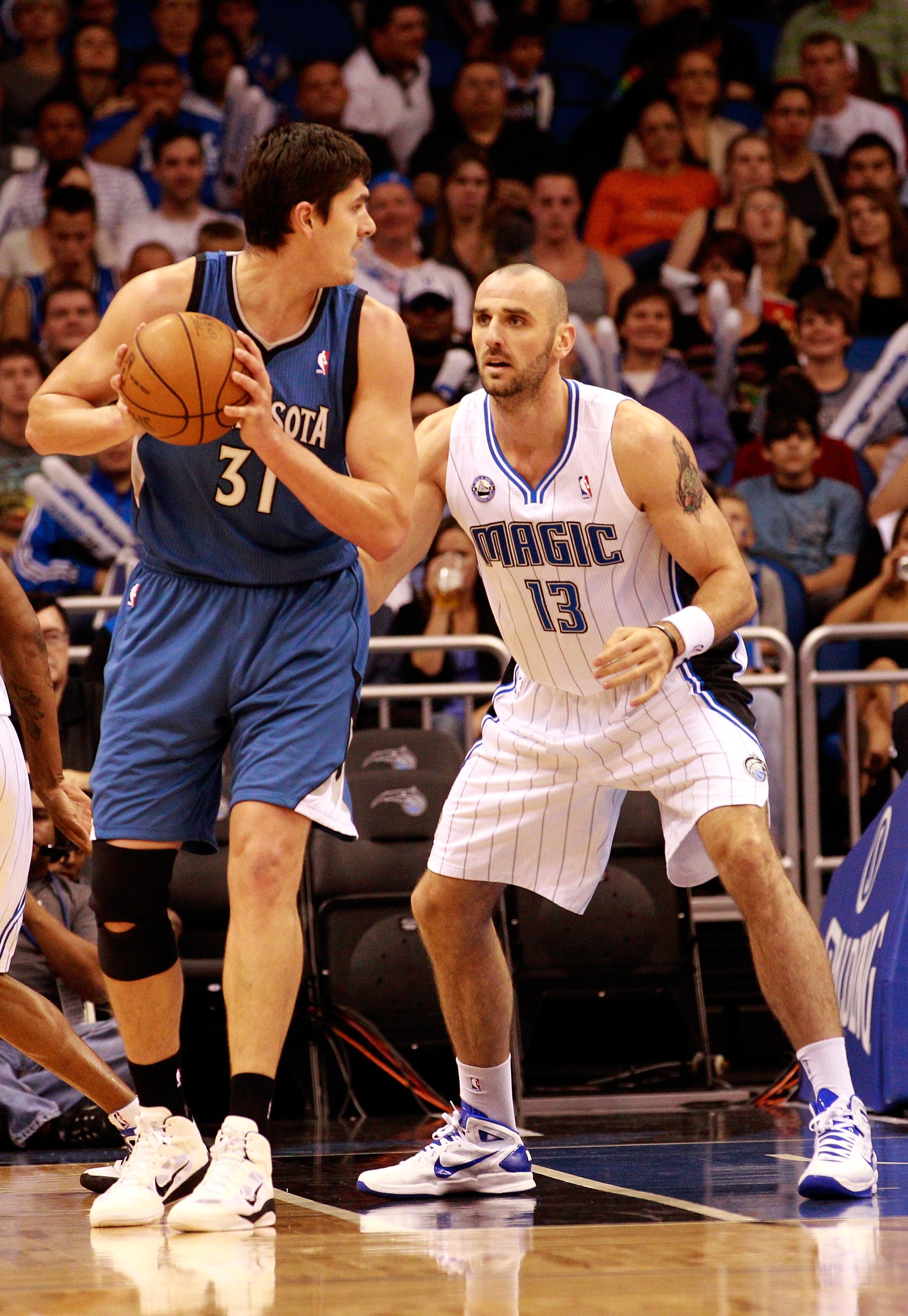 ORLANDO, FL - NOVEMBER 03:   Marcin Gortat #13 of the Orlando Magic guards Darko Milicic #31 of the Minnesota Timberwolves during the game at Amway Arena on November 3, 2010 in Orlando, Florida.  NOTE TO USER: User expressly acknowledges and agrees that,