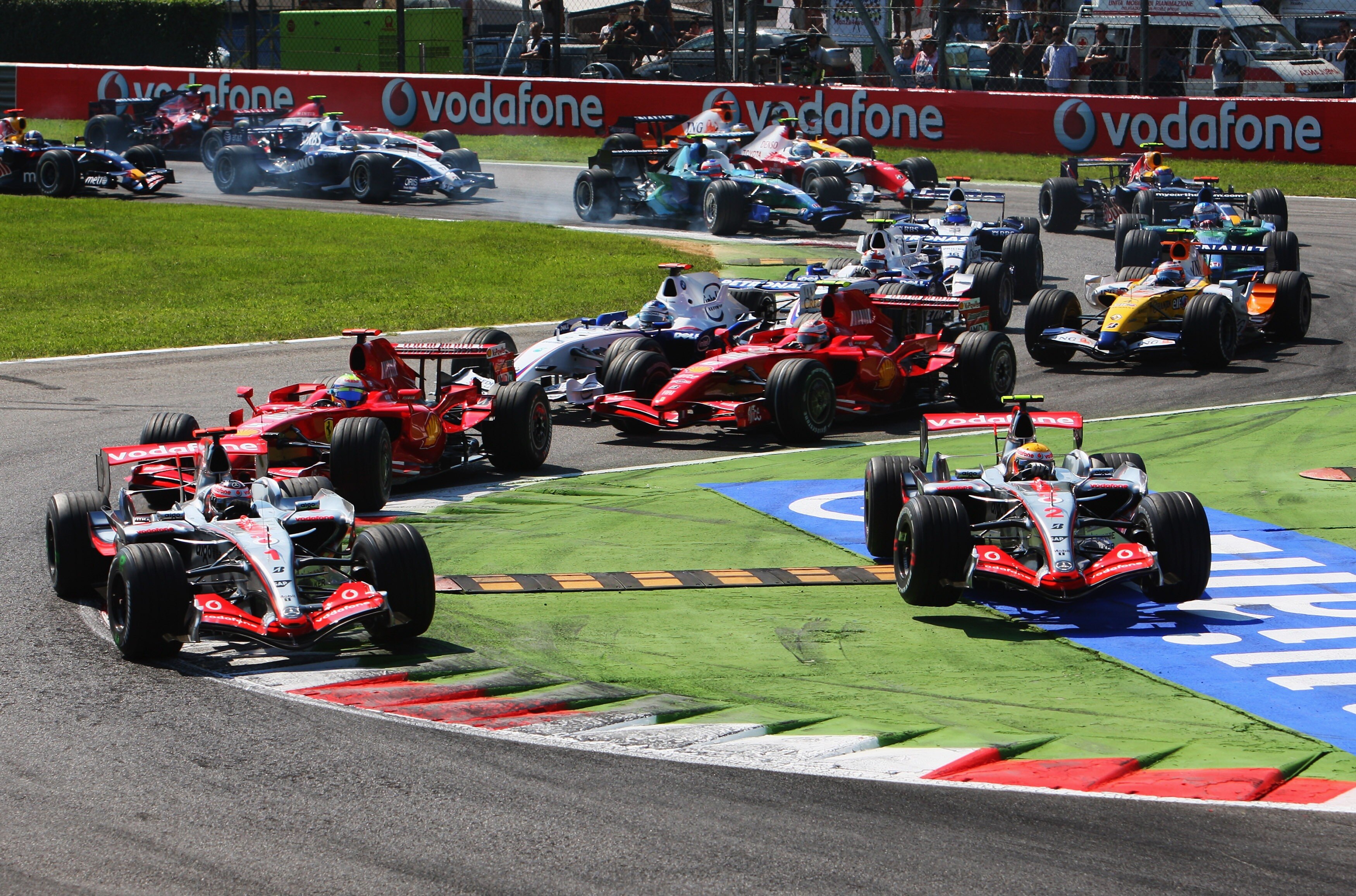 MONZA, ITALY - SEPTEMBER 09:  Fernando Alonso of Spain and McLaren leads from Felipe Massa of Brazil and Ferrari as Lewis Hamilton of Great Britain and McLaren Mercedes crosses the chicane during the Italian Formula One Grand Prix at the Autodromo Naziona