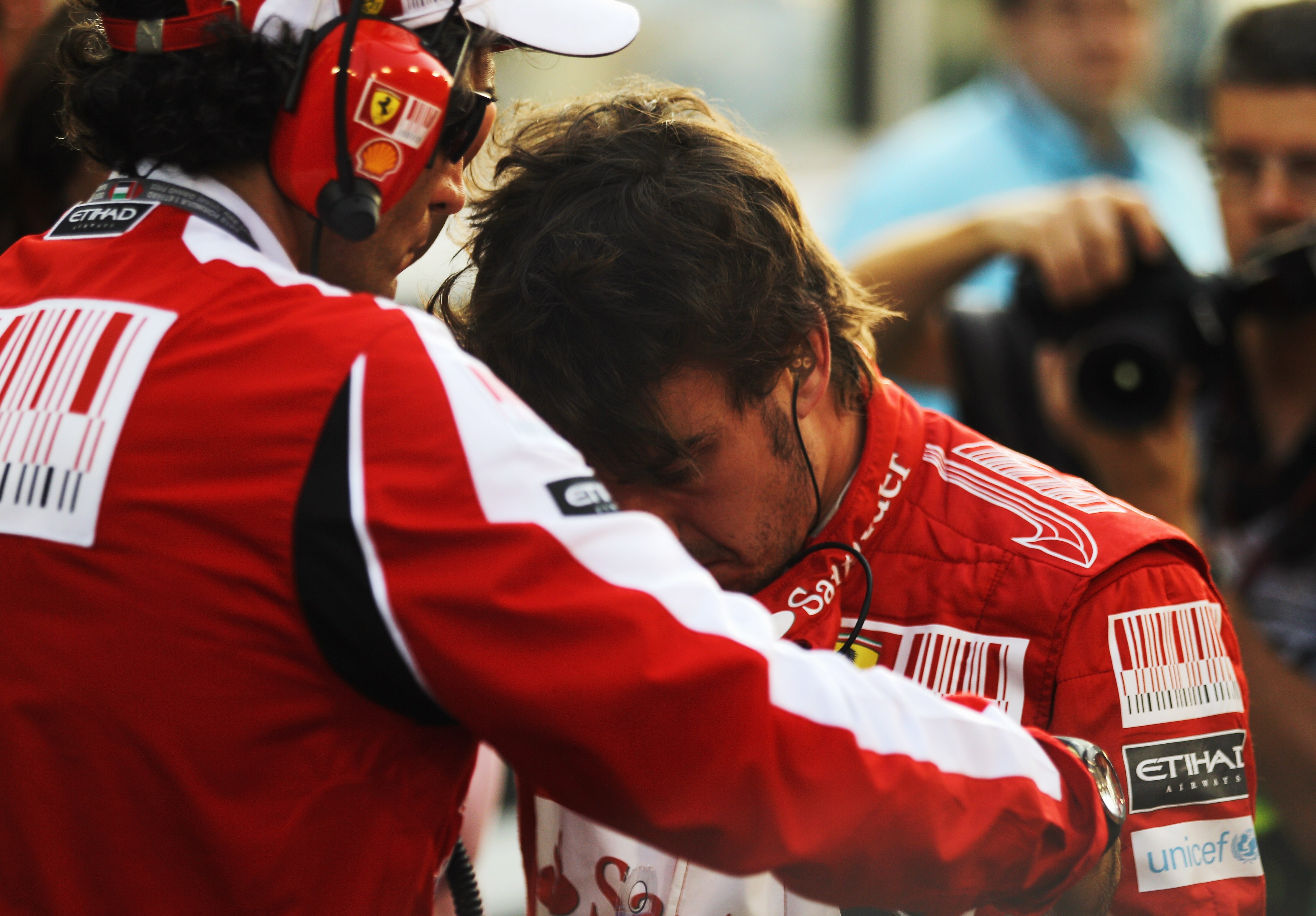 ABU DHABI, UNITED ARAB EMIRATES - NOVEMBER 14:  Fernando Alonso of Spain and Ferrari is seen on the grid as he prepares to drive during the Abu Dhabi Formula One Grand Prix at the Yas Marina Circuit on November 14, 2010 in Abu Dhabi, United Arab Emirates.