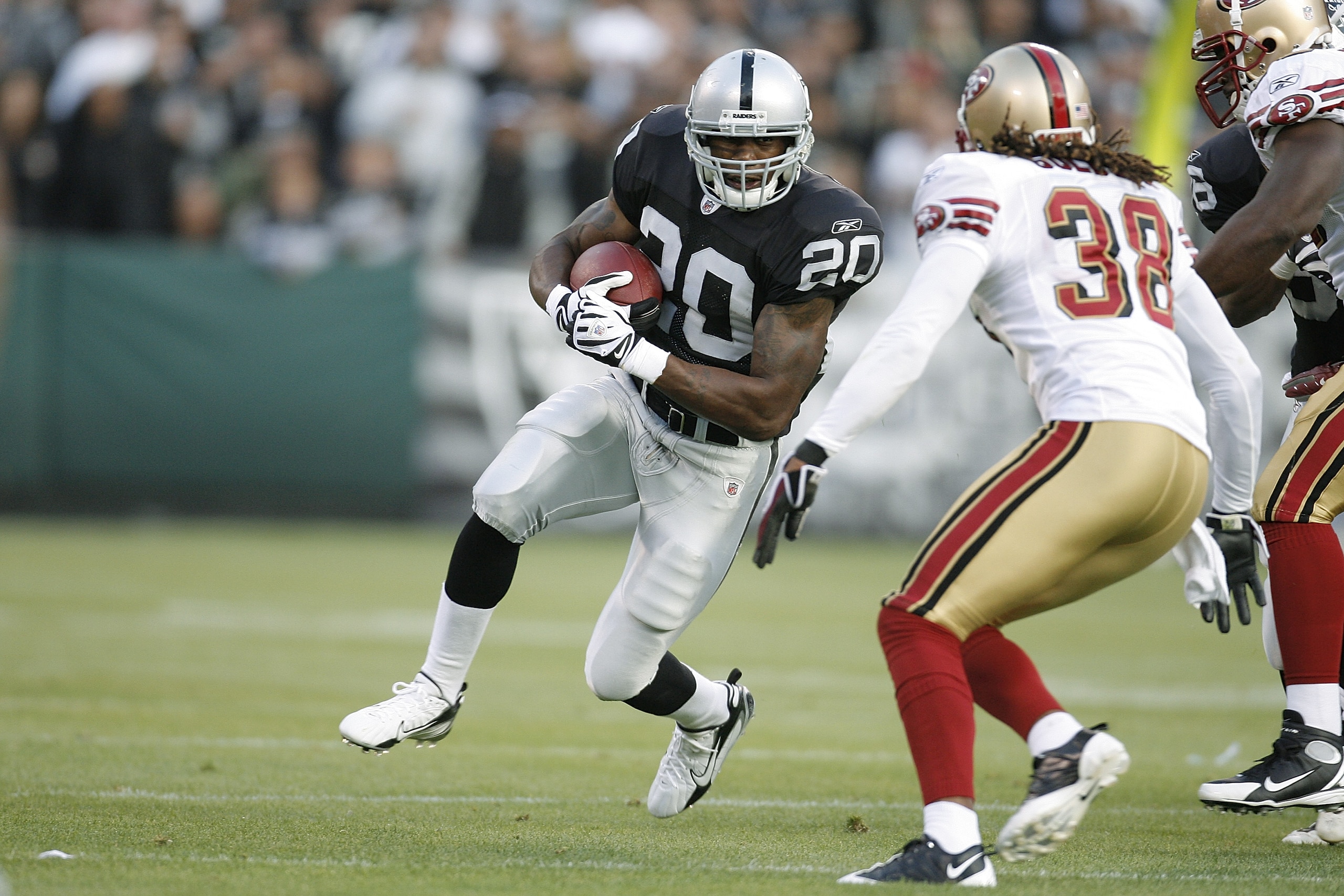 OAKLAND, CA - AUGUST 08:  Running back Darren McFadden #20 of the Oakland Raiders looks for running room against the San Francisco 49ers on August 8, 2008 at McAfee Coliseum in Oakland, California.  (Photo by Greg Trott/Getty Images)