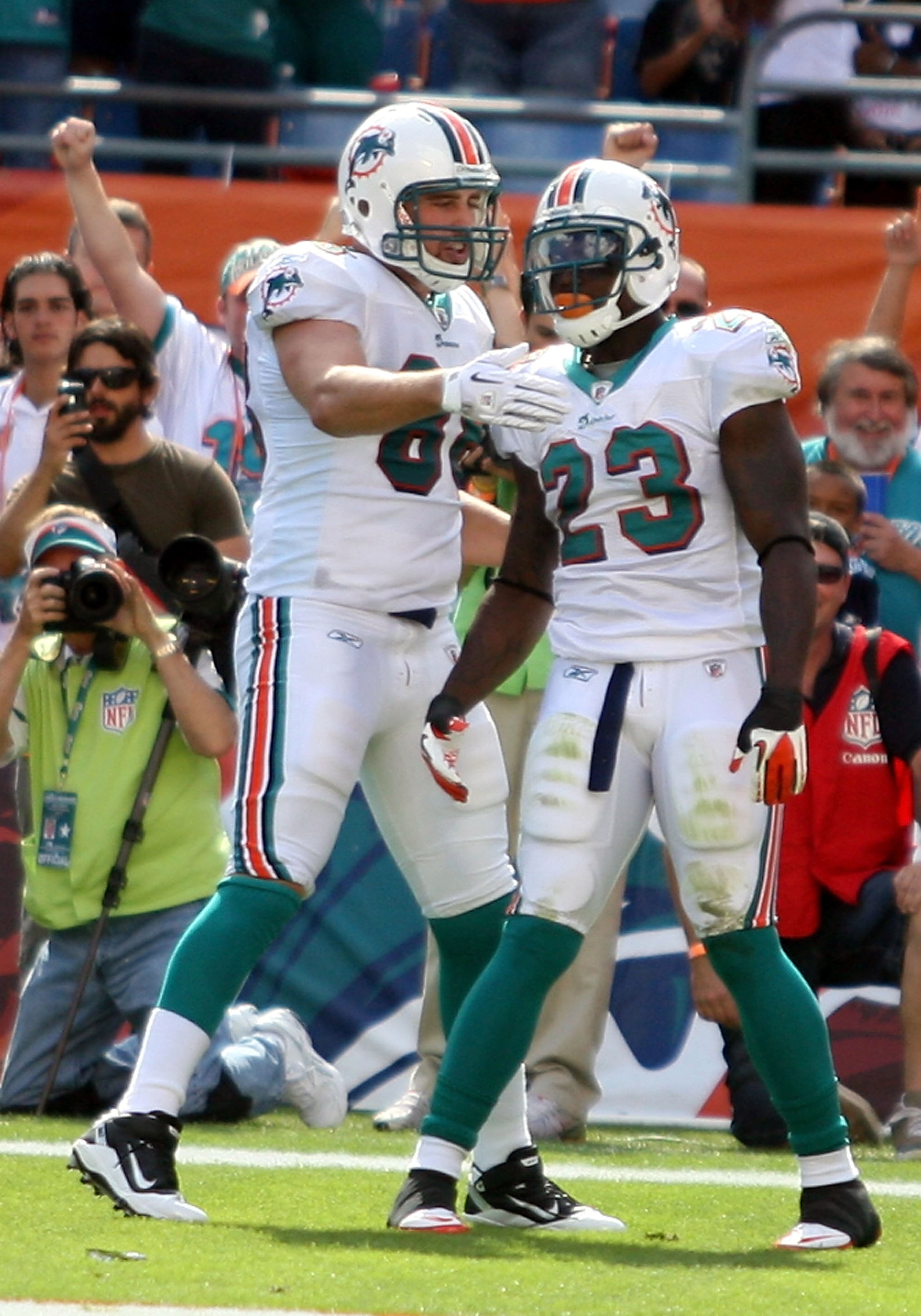 MIAMI - NOVEMBER 14:  Running Back Ronnie Brown #23 of the Miami Dolphins celebrates a touchdown with teammate Anthony Fasano #80 against the Tennessee Titans at Sun Life Stadium on November 14, 2010 in Miami, Florida.  (Photo by Marc Serota/Getty Images)