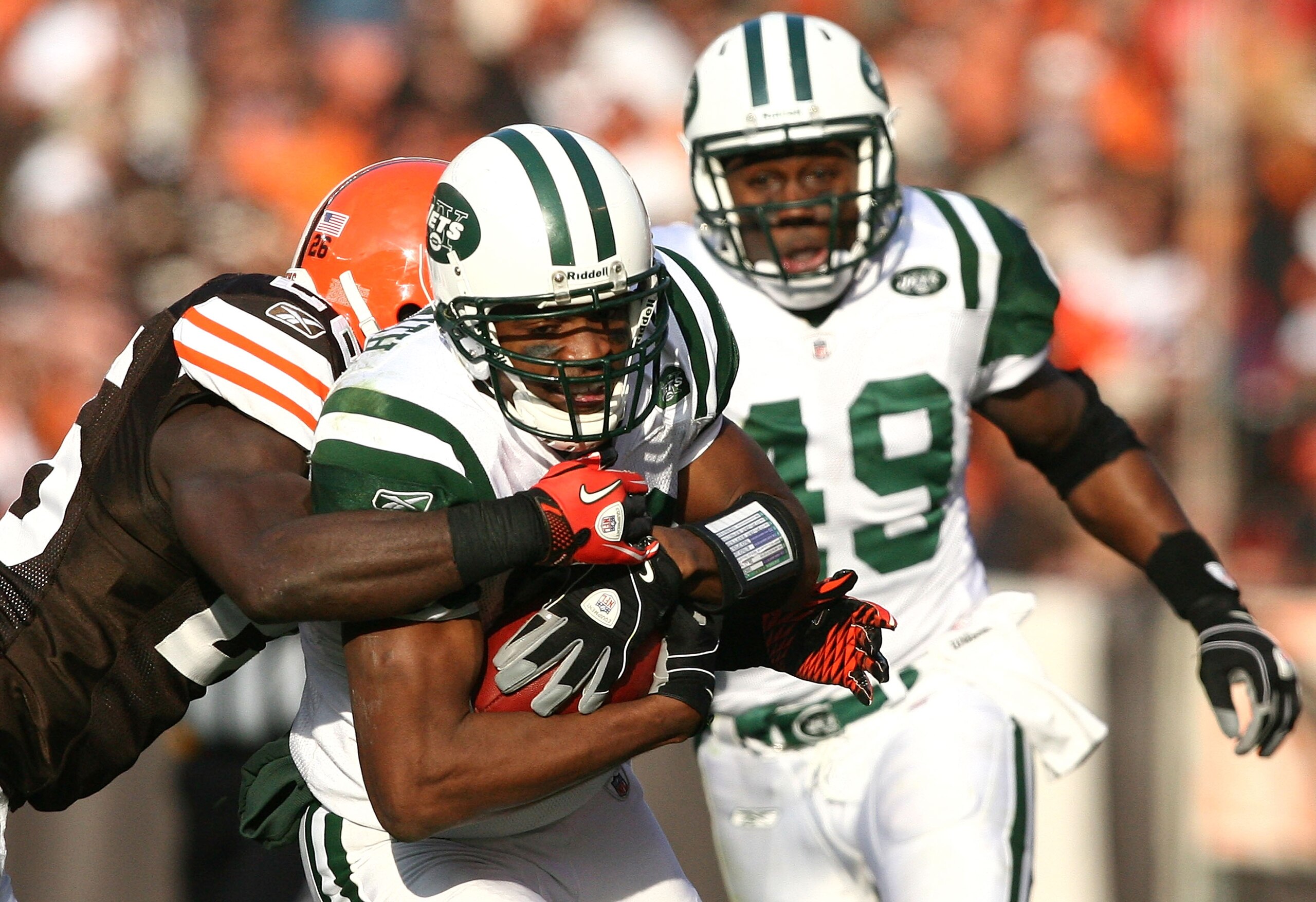 CLEVELAND - NOVEMBER 14:  Wide receiver Brad Smith #16 of the New York Jets is hit by defensive back Abram Elam #26 of the Cleveland Browns as Tony Richardson #49 looks on at Cleveland Browns Stadium on November 14, 2010 in Cleveland, Ohio.  (Photo by Mat