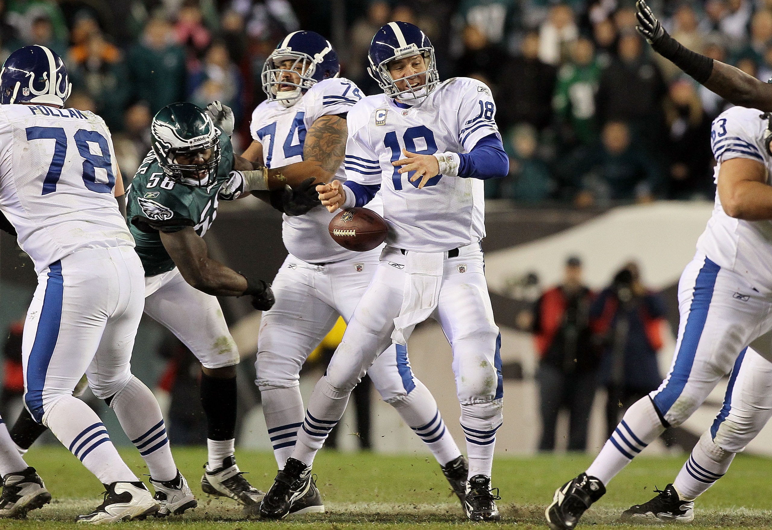 PHILADELPHIA - NOVEMBER 07:  Trent Cole #58 of the Philadelphia Eagles forces a fumble from Peyton Manning #18 of the Indianapolis Colts during the fourth quater on November 7, 2010 at Lincoln Financial Field in Philadelphia, Pennsylvania. The Eagles defe