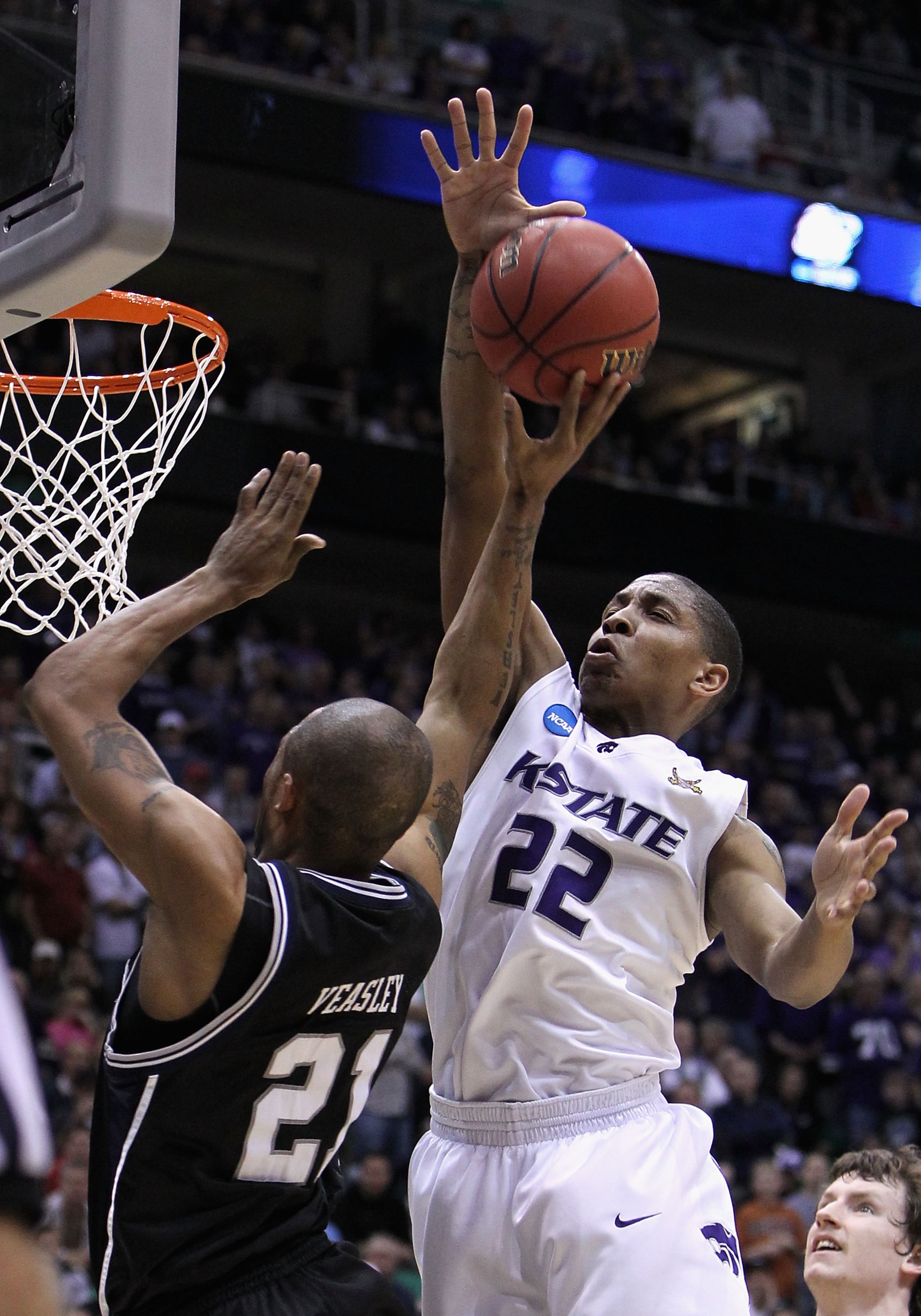SALT LAKE CITY - MARCH 27: Willie Veasley #21 of the Butler Bulldogs puts up a shot under pressure from Rodney McGruder #22 of the Kansas State Wildcats during the west regional final of the 2010 NCAA men's basketball tournament at the Energy Solutions A SALT LAKE CITY - MARCH 27: Willie Veasley #21 of the Butler Bulldogs puts up a shot under pressure from Rodney McGruder #22 of the Kansas State Wildcats during the west regional final of the 2010 NCAA men's basketball tournament at the Energy Solutions A