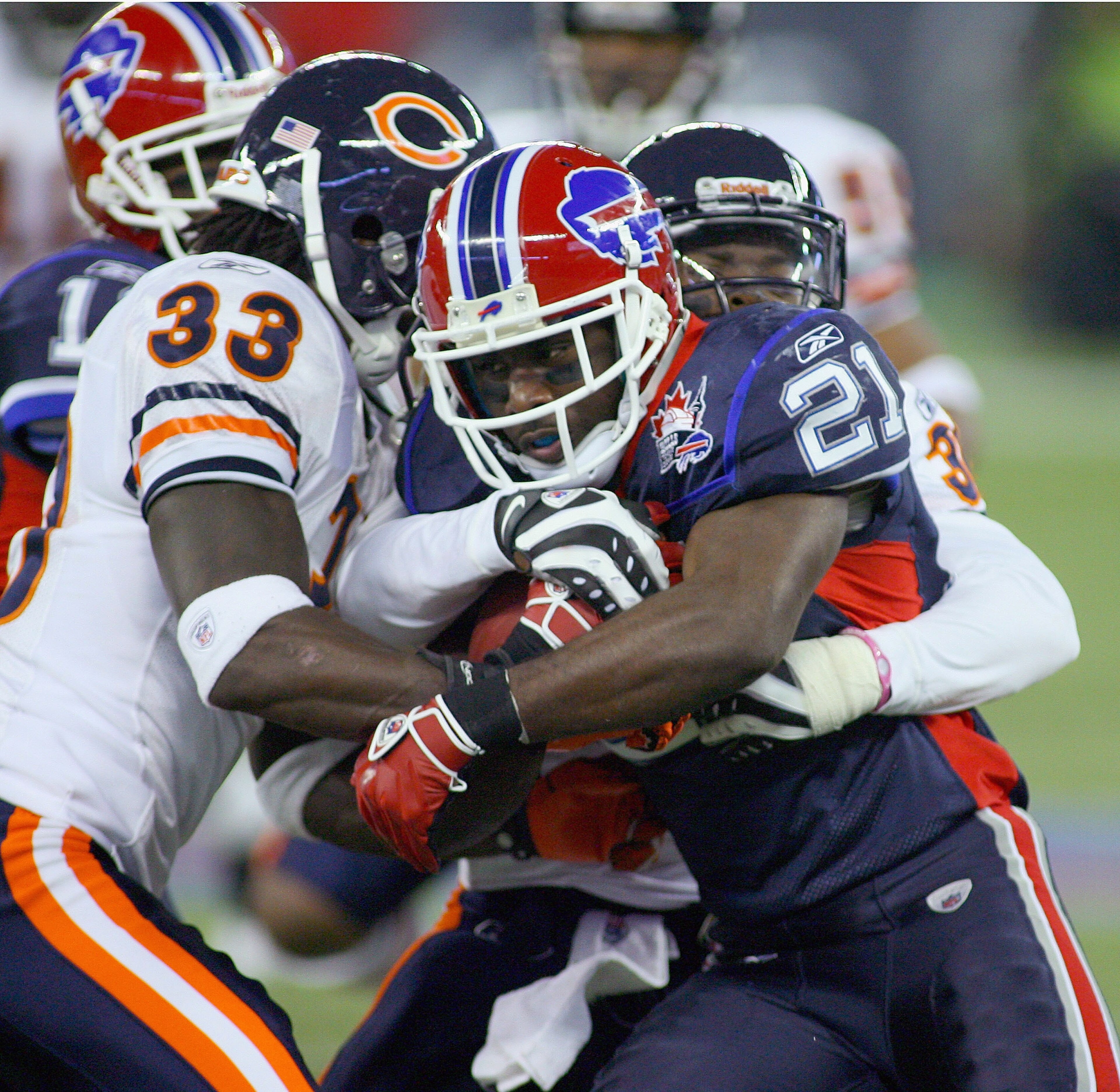 TORONTO, ON - NOVEMBER 07: C.J. Spiller #21 of the Buffalo Bills is tackled by Charles Tillman #33 and C.J. Moore #30 of the Chicago Bears at Rogers Centre on November 7, 2010 in Toronto, Canada. Chicago won 22-19. (Photo by Rick Stewart/Getty Images) TORONTO, ON - NOVEMBER 07: C.J. Spiller #21 of the Buffalo Bills is tackled by Charles Tillman #33 and C.J. Moore #30 of the Chicago Bears at Rogers Centre on November 7, 2010 in Toronto, Canada. Chicago won 22-19. (Photo by Rick Stewart/Getty Images)