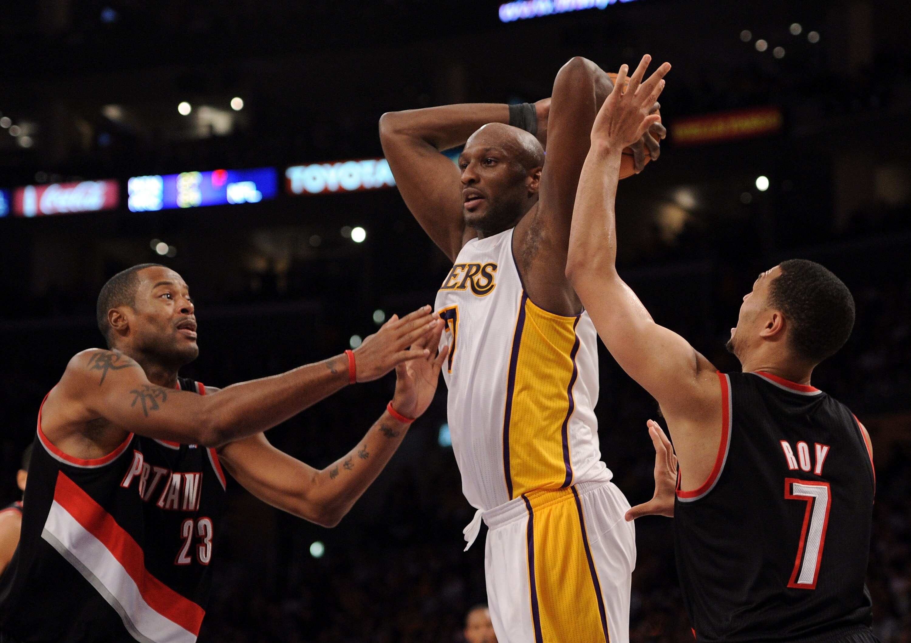 LOS ANGELES, CA - NOVEMBER 07:  Portrait of Lamar Odum #7 of the Los Angeles Lakers attempts a pass between Marcus Camby #23 and Brandon Roy #7 of the Portland Trail Blazers at the Staples Center on November 7, 2010 in Los Angeles, California.  NOTE TO US
