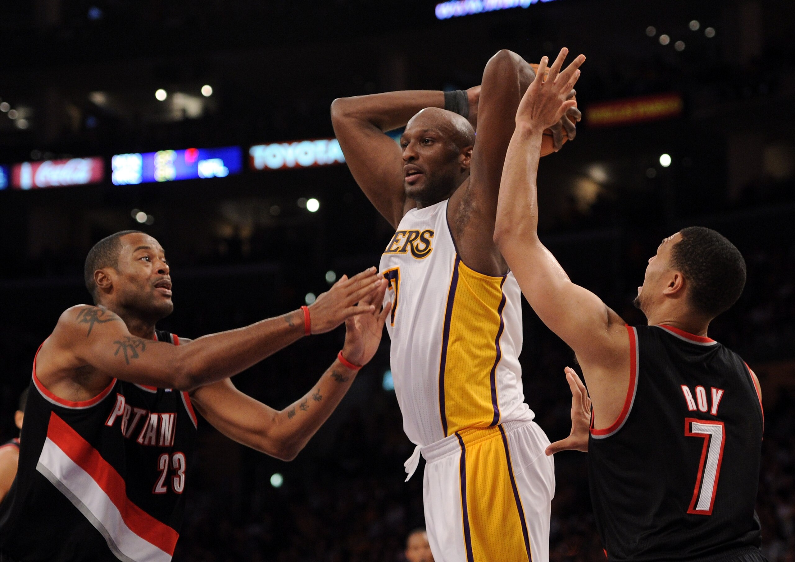 LOS ANGELES, CA - NOVEMBER 07:  Portrait of Lamar Odum #7 of the Los Angeles Lakers attempts a pass between Marcus Camby #23 and Brandon Roy #7 of the Portland Trail Blazers at the Staples Center on November 7, 2010 in Los Angeles, California.  NOTE TO US