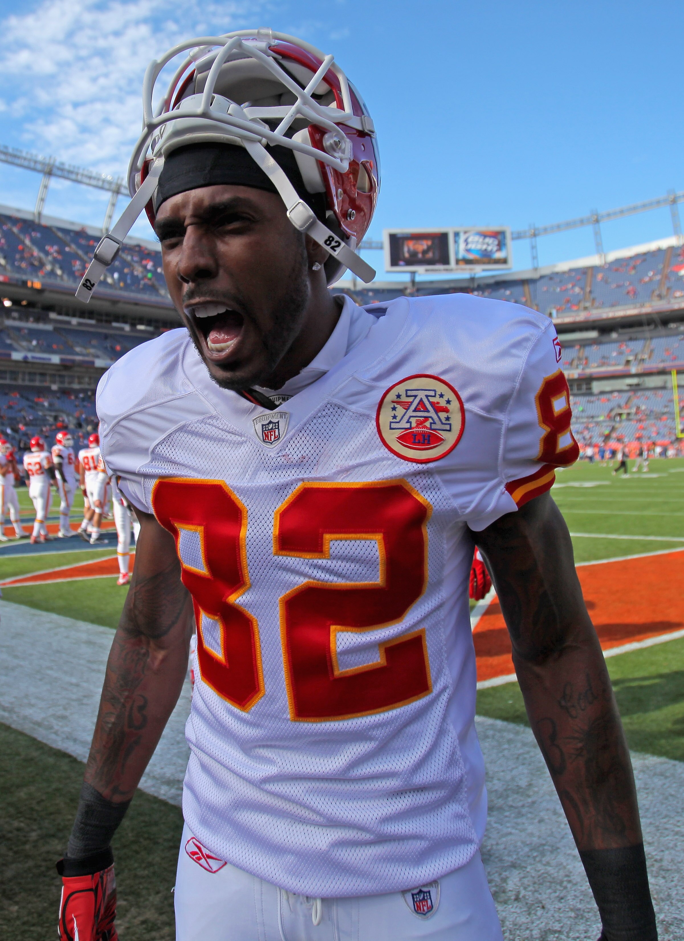 DENVER - NOVEMBER 14:  Dwayne Bowe #82 of the Kansas City Chiefs welcomes his teammates onto the field for warm ups as they face the Denver Broncos at INVESCO Field at Mile High on November 14, 2010 in Denver, Colorado. The Broncos defeated the Chiefs 49-
