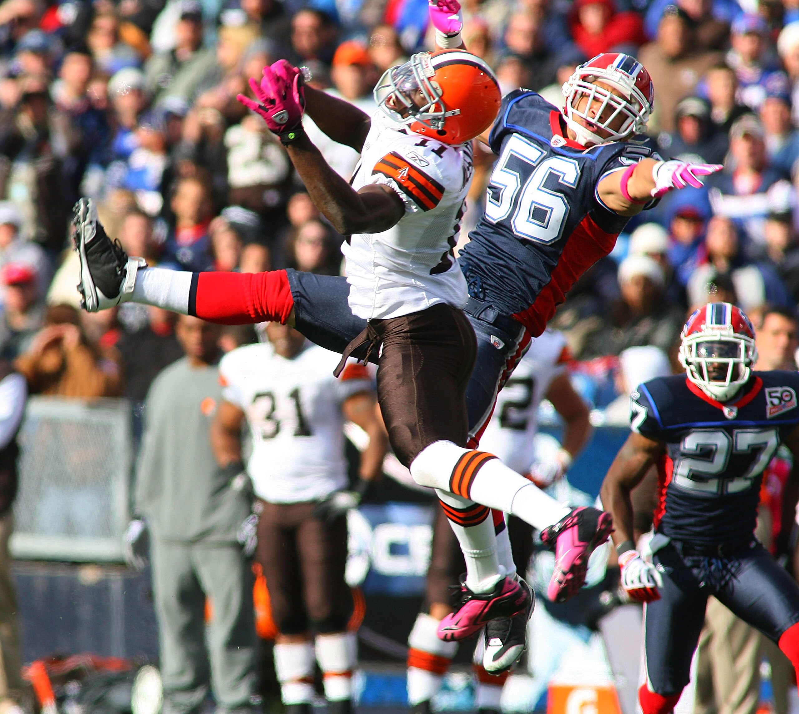 ORCHARD PARK, NY - OCTOBER 11: Mohammed Massaquoi #11 of the Cleveland Browns and Keith Ellison #56 of the Buffalo Bills try to make a play at Ralph Wilson Stadium on October 11, 2009 in Orchard Park, New York. (Photo by Rick Stewart/Getty Images) ORCHARD PARK, NY - OCTOBER 11: Mohammed Massaquoi #11 of the Cleveland Browns and Keith Ellison #56 of the Buffalo Bills try to make a play at Ralph Wilson Stadium on October 11, 2009 in Orchard Park, New York. (Photo by Rick Stewart/Getty Images)