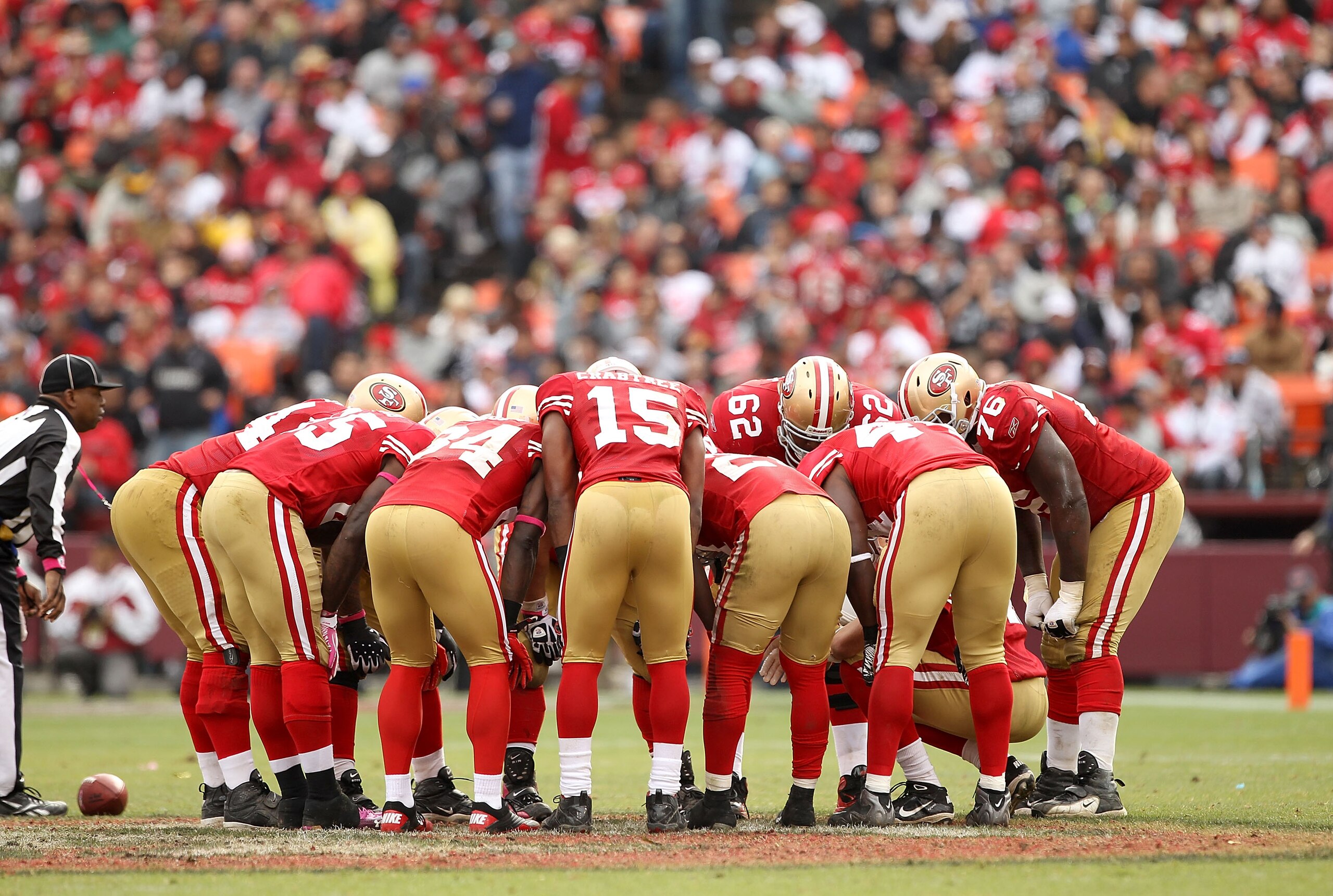 SAN FRANCISCO - OCTOBER 17: The San Francisco 49ers huddle together during their game against the Oakland Raiders at Candlestick Park on October 17, 2010 in San Francisco, California.  (Photo by Ezra Shaw/Getty Images)