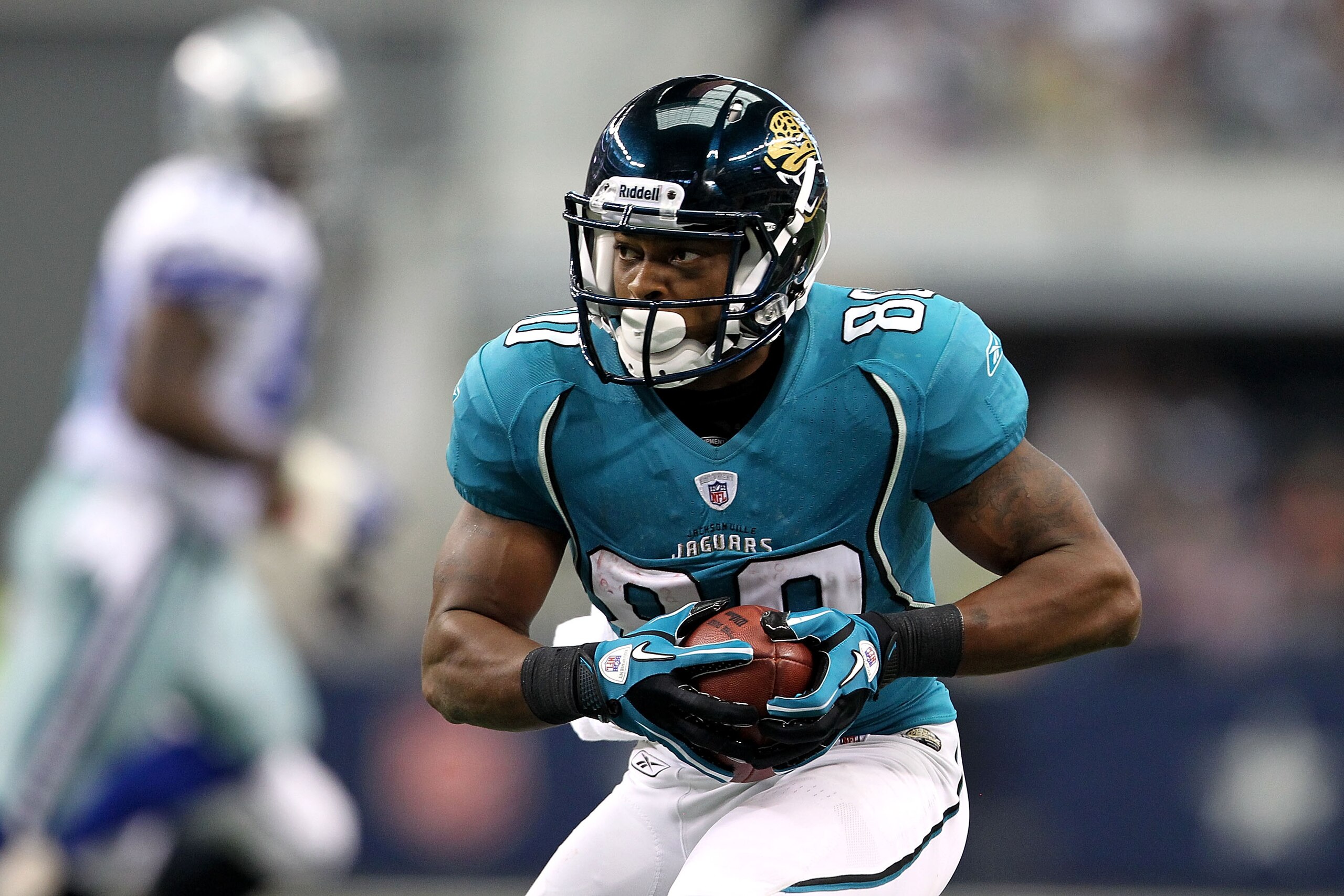 ARLINGTON, TX - OCTOBER 31: Mike Thomas #80 of the Jacksonville Jaguars runs for yards after the catch as he scores on a 15-yard touchdown reception in the third quarter against the Dallas Cowboys at Cowboys Stadium on October 31, 2010 in Arlington, Texa ARLINGTON, TX - OCTOBER 31: Mike Thomas #80 of the Jacksonville Jaguars runs for yards after the catch as he scores on a 15-yard touchdown reception in the third quarter against the Dallas Cowboys at Cowboys Stadium on October 31, 2010 in Arlington, Texa
