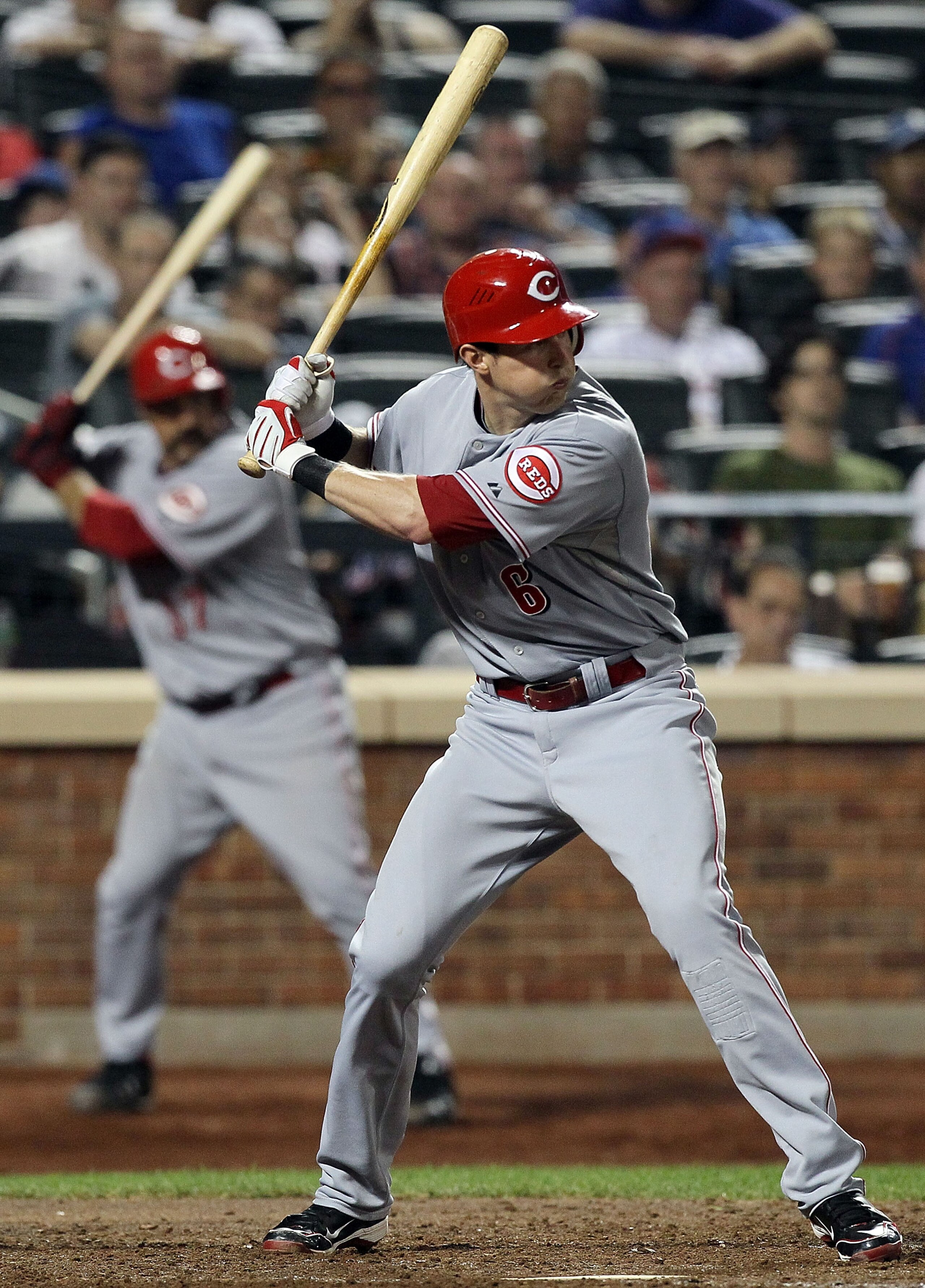 NEW YORK - JULY 07:  Drew Stubbs #6 of the Cincinnati Reds bats against the New York Mets as teammate Corky Miller #37 waits on deck on July 7, 2010 at Citi Field in the Flushing neighborhood of the Queens borough of New York City.  (Photo by Jim McIsaac/