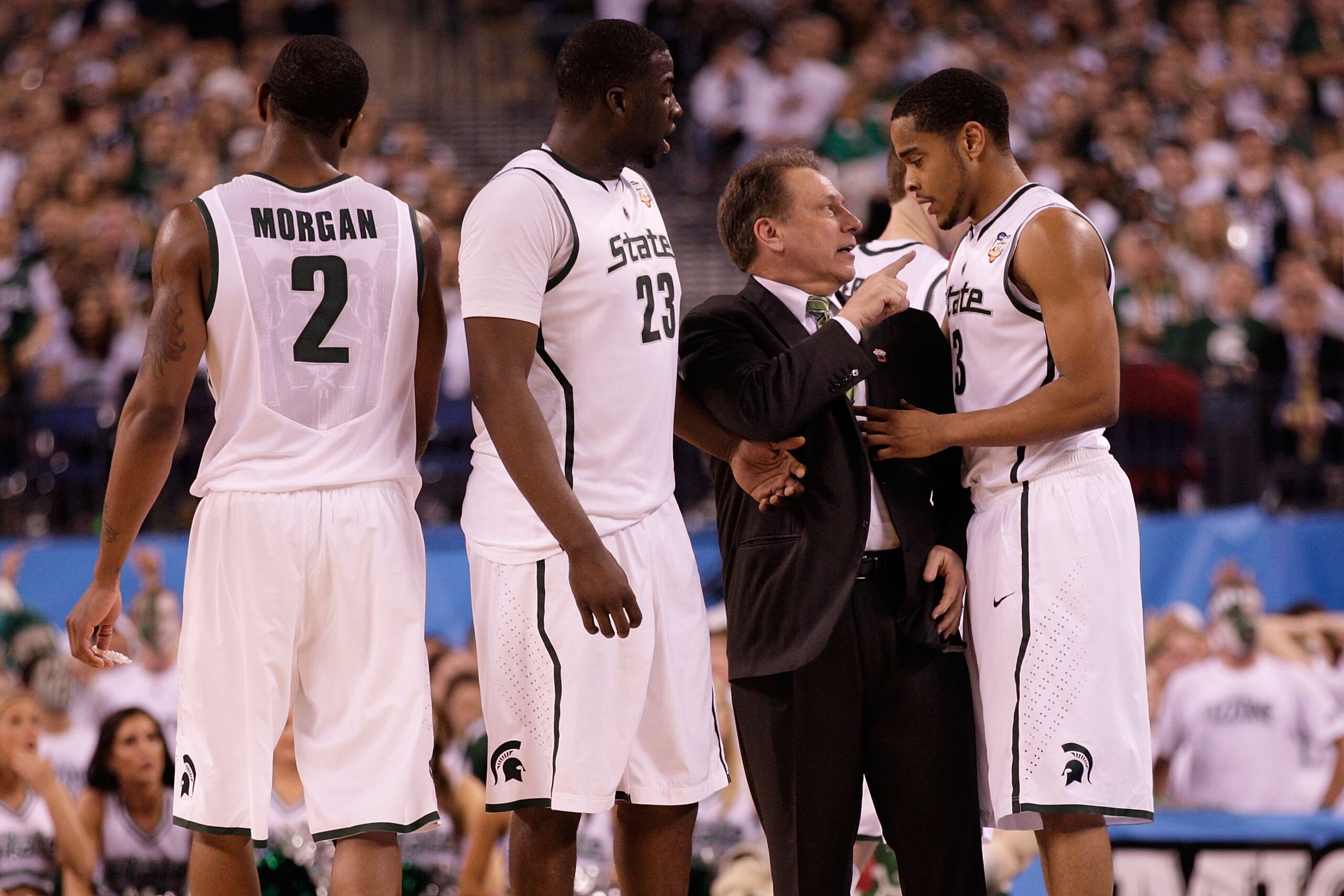 INDIANAPOLIS - APRIL 03:  Head coach Tom Izzo of the Michigan State Spartans talks with Chris Allen #3 from the sideline while taking on the Butler Bulldogs during the National Semifinal game of the 2010 NCAA Division I Men's Basketball Championship on Ap