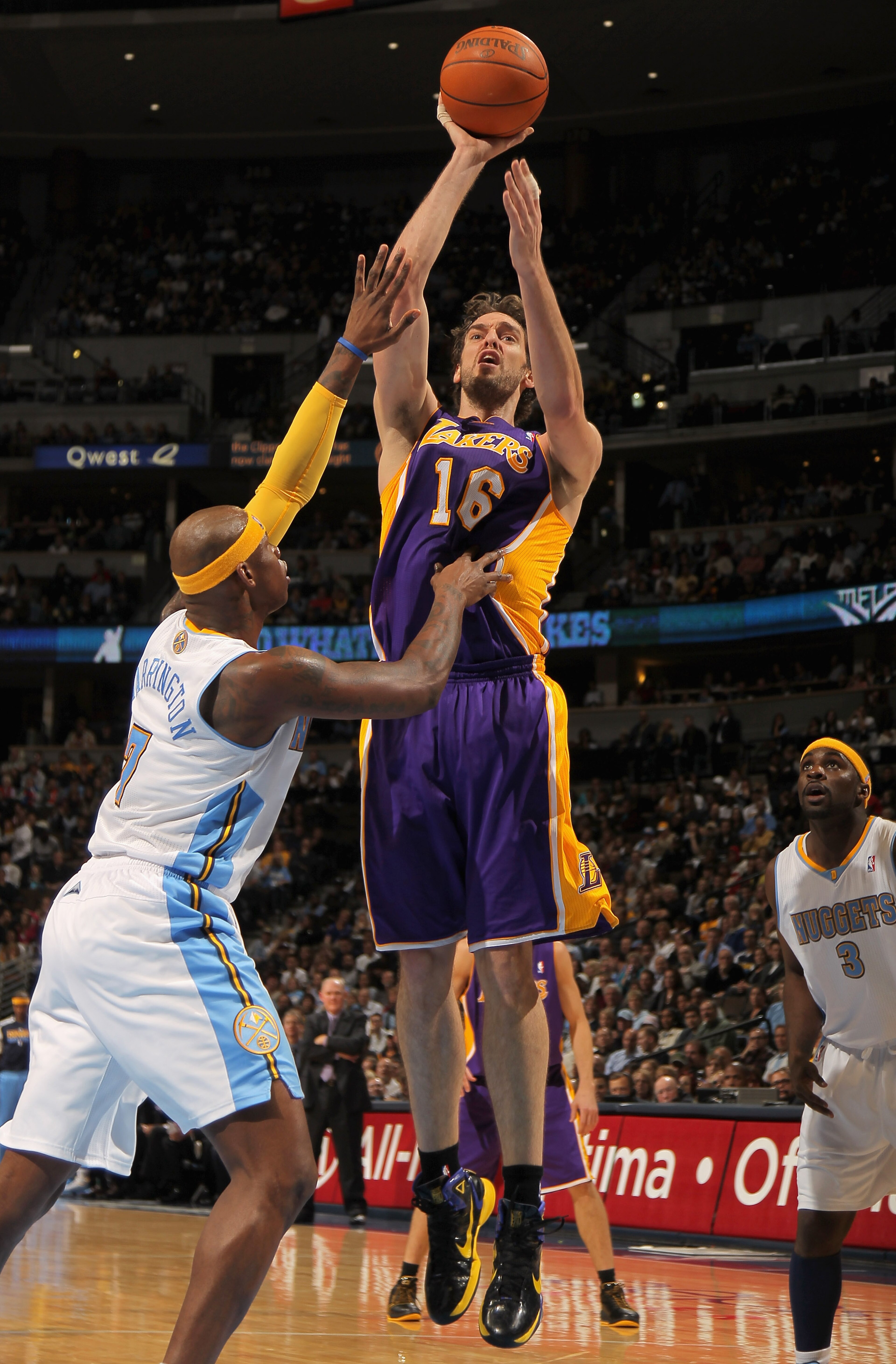 DENVER - NOVEMBER 11:  Pau Gasol #16 of the Los Angeles Lakers takes a shot over Al Harrington #7 of the Denver Nuggets at the Pepsi Center on November 11, 2010 in Denver, Colorado. The Nuggets defeated the Lakers 118-112.  NOTE TO USER: User expressly ac