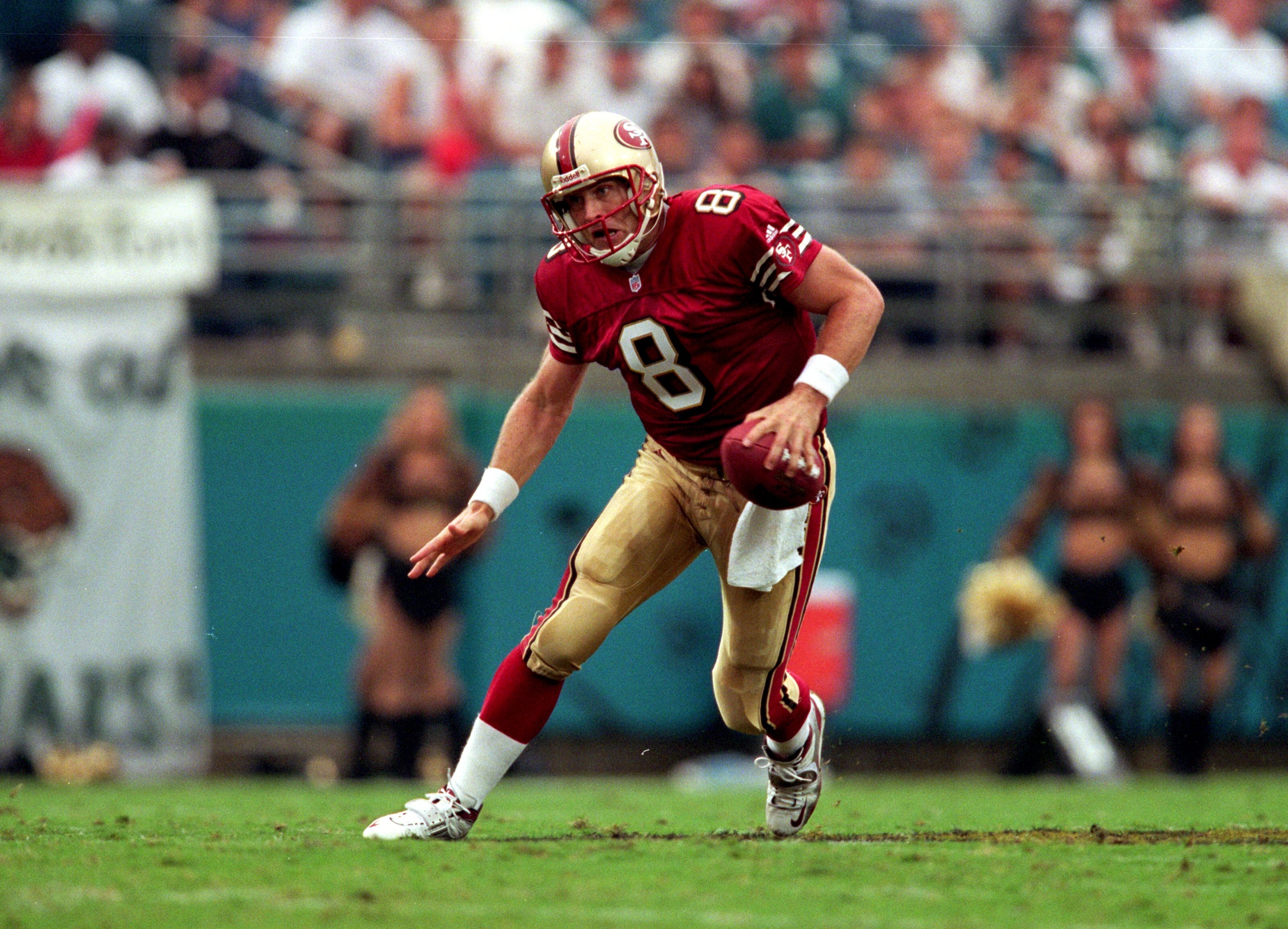 12 Sep 1999:  Steve Young #8 of the San Francisco 49ers moves with the ball during the game against the Jacksonville Jaguars at the Alltell Stadium in Jacksonville, Florida. The Jaguars defeated the 49ers 41-3. Mandatory Credit: Andy Lyons  /Allsport