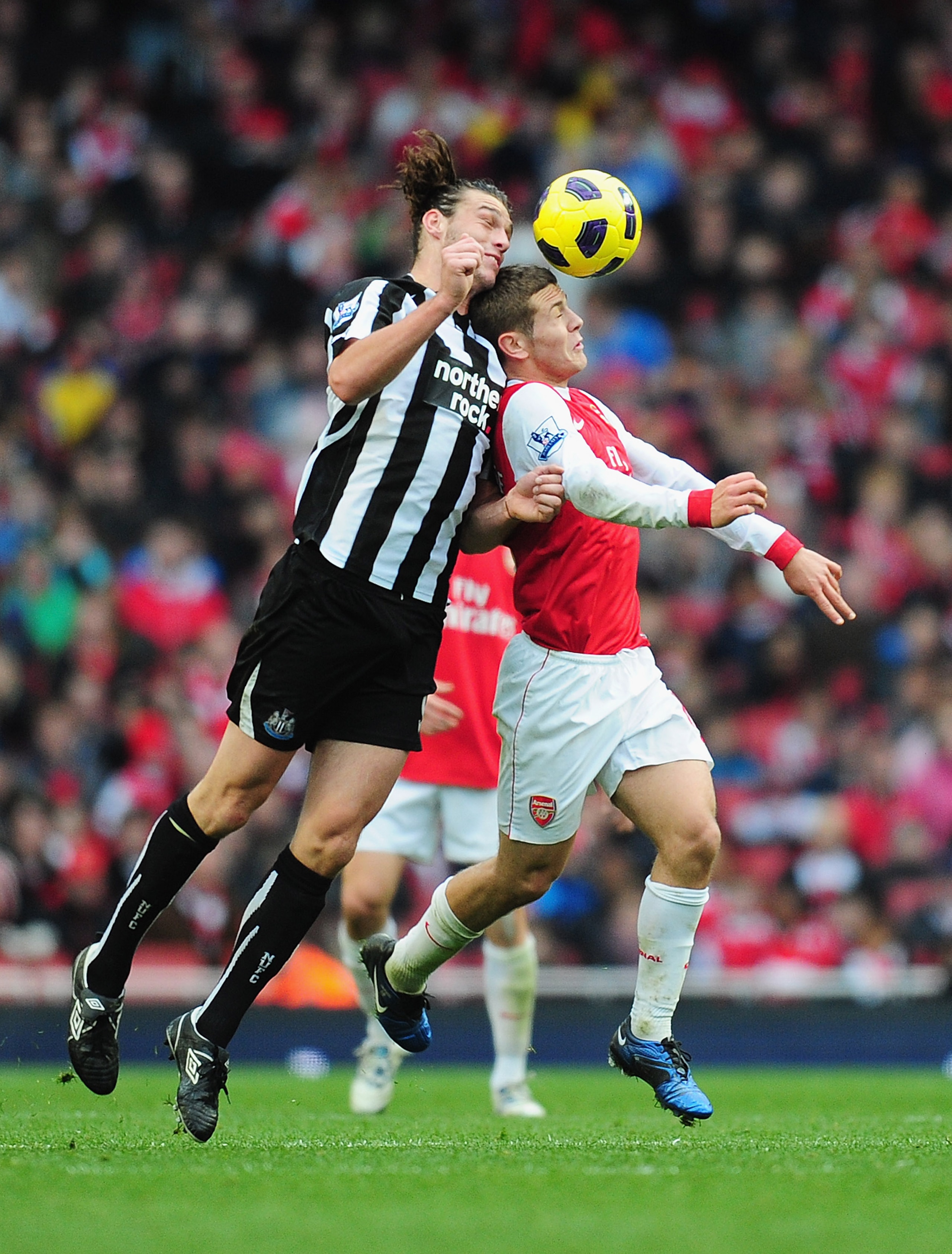 LONDON, ENGLAND - NOVEMBER 07: Andy Carroll of Newcastle challenges Jack Wilshere of Arsenal during the Barclays Premier League match between Arsenal and Newcastle United at the Emirates Stadium on November 7, 2010 in London, England. (Photo by Mike Hew LONDON, ENGLAND - NOVEMBER 07: Andy Carroll of Newcastle challenges Jack Wilshere of Arsenal during the Barclays Premier League match between Arsenal and Newcastle United at the Emirates Stadium on November 7, 2010 in London, England. (Photo by Mike Hew