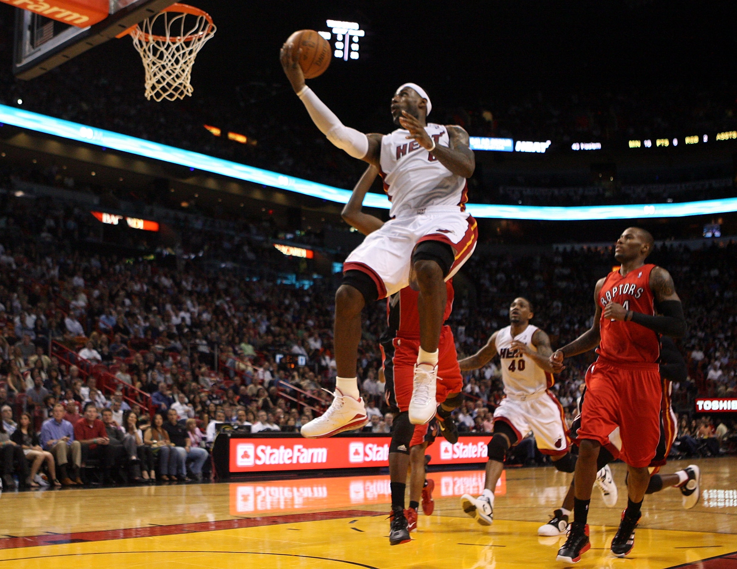 MIAMI - NOVEMBER 13:  Forward LeBron James #6 of the Miami Heat scores against the Toronto Raptors at American Airlines Arena on November 13, 2010 in Miami, Florida. NOTE TO USER: User expressly acknowledges and agrees that, by downloading and or using th