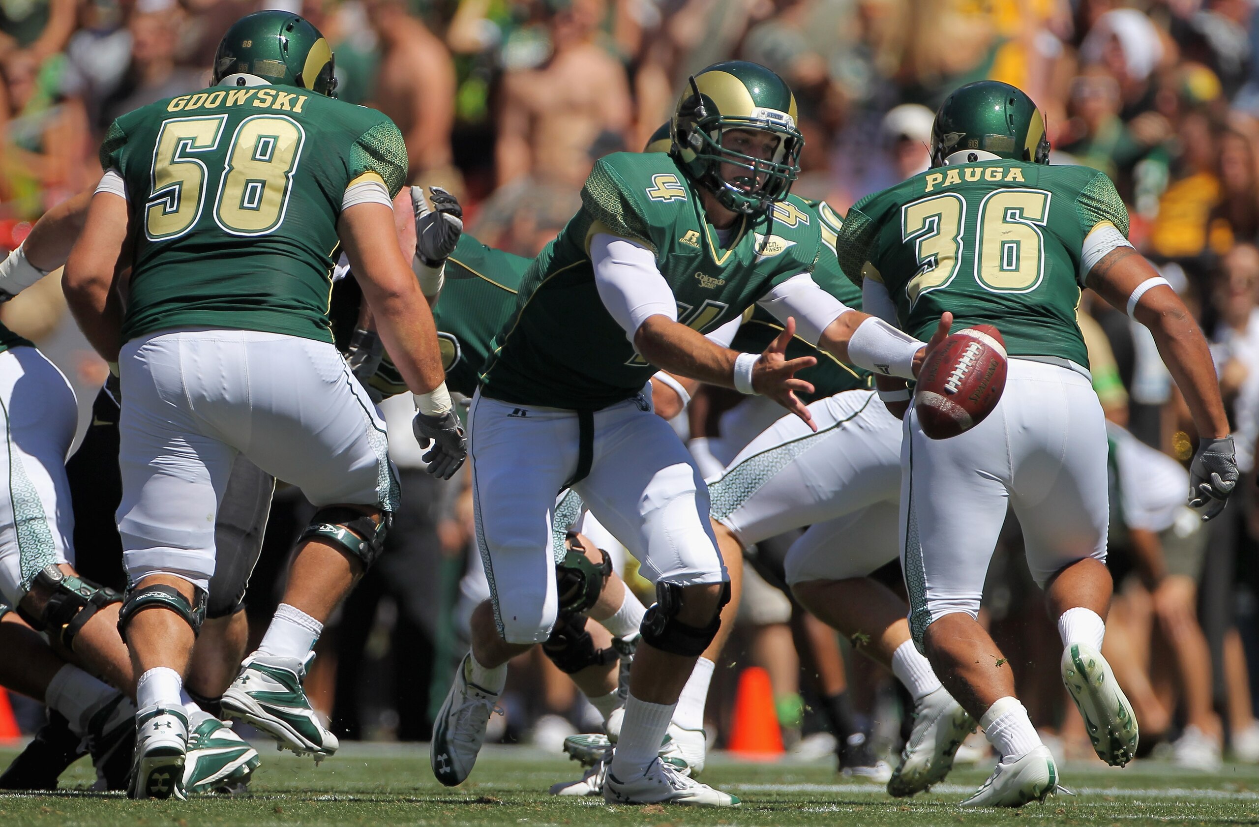DENVER - SEPTEMBER 04:  Quarterback Pete Thomas #4 of the Colorado State Rams bobbles the ball and recovered his own fumble against the Colorado Buffaloes during the the Rocky Mountain Showdown at INVESCO Field at Mile High on September 4, 2010 in Denver,