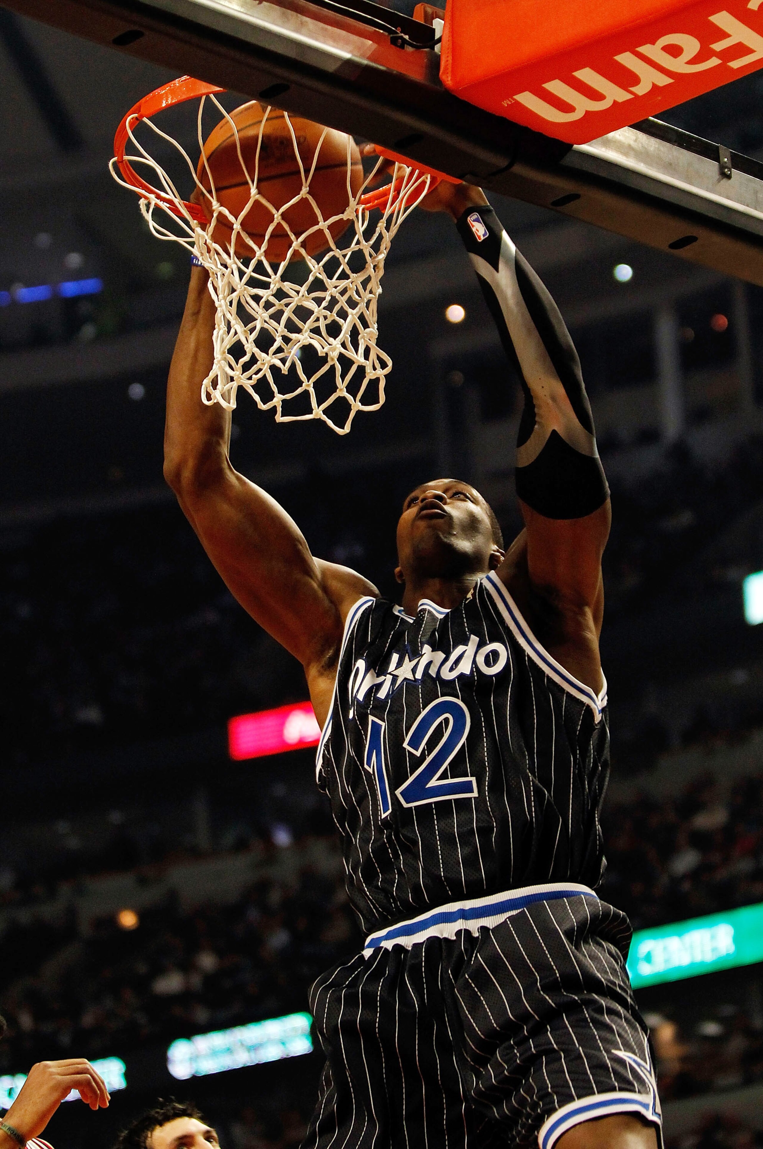 CHICAGO - FEBRUARY 10: Dwight Howard #12 of the Orlando Magic dunks the ball against the Chicago Bulls at the United Center on February 10, 2010 in Chicago, Illinois. NOTE TO USER: User expressly acknowledges and agrees that, by downloading and/or using t