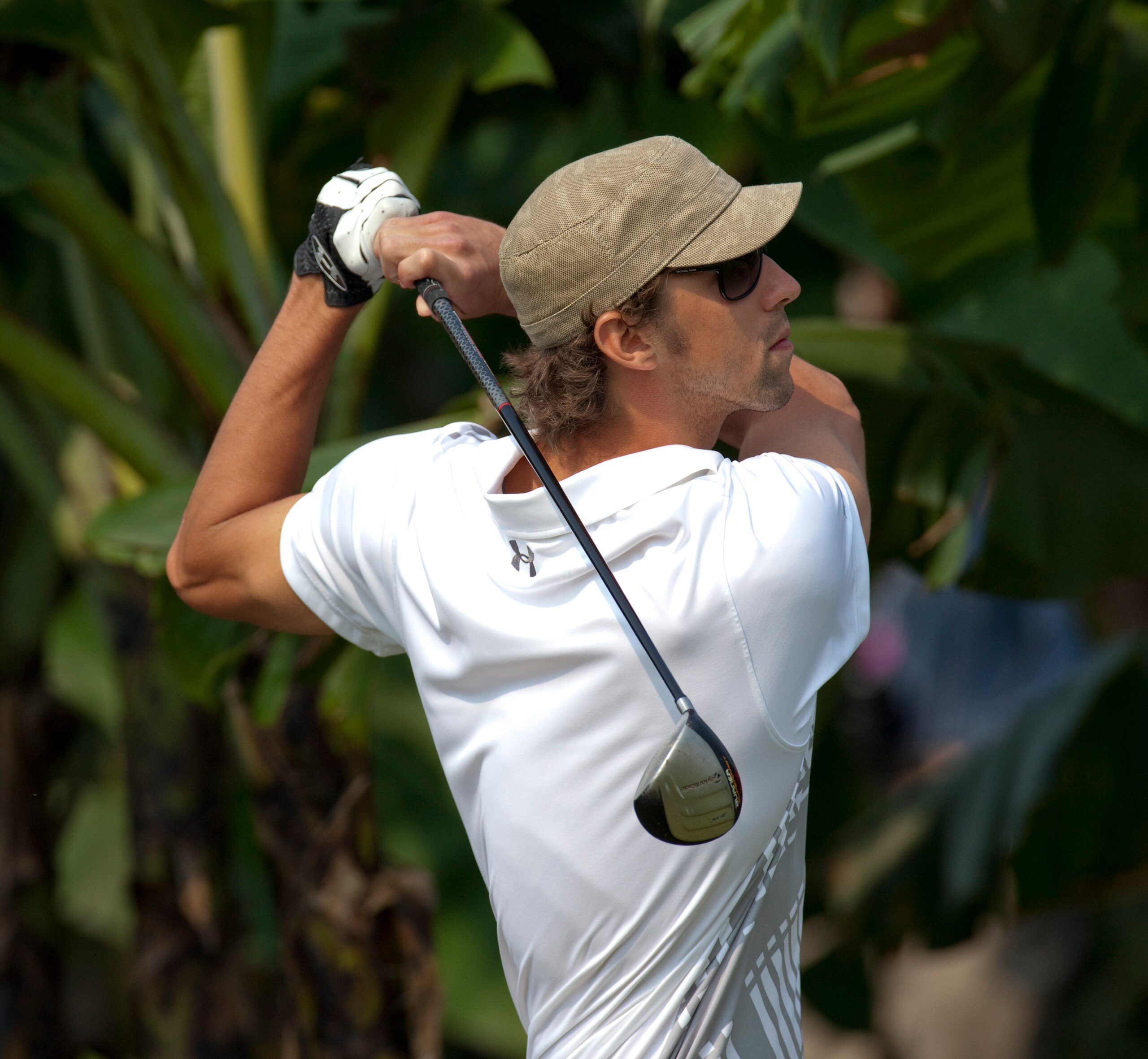 HAIKOU, CHINA - OCTOBER 31:  Michael Phelps of USA plays a shot during day five of the Mission Hills Start Trophy tournament at Mission Hills Resort on October 31, 2010 in Haikou, China. The Mission Hills Star Trophy is Asia's leading leisure liflestyle e