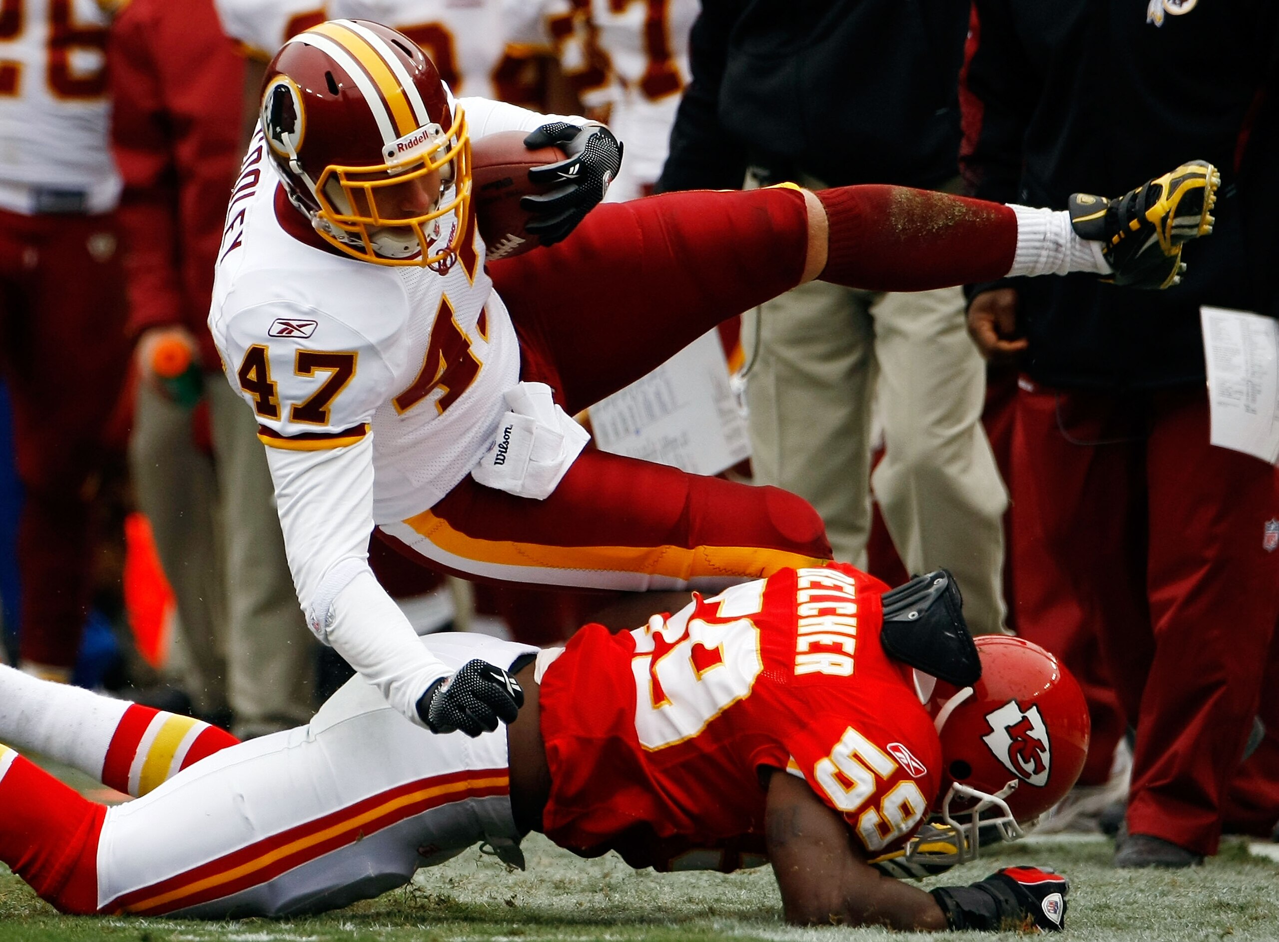LANDOVER, MD - OCTOBER 18: Tight end Chris Cooley #47 of the Washington Redskins is tackled by Derrick Johnson #58 of the Kansas City Chiefs during their game October 18, 2009 at FedEx Field in Landover, Maryland. Kansas City kicker Ryan Succop had 4 fiel LANDOVER, MD - OCTOBER 18: Tight end Chris Cooley #47 of the Washington Redskins is tackled by Derrick Johnson #58 of the Kansas City Chiefs during their game October 18, 2009 at FedEx Field in Landover, Maryland. Kansas City kicker Ryan Succop had 4 fiel