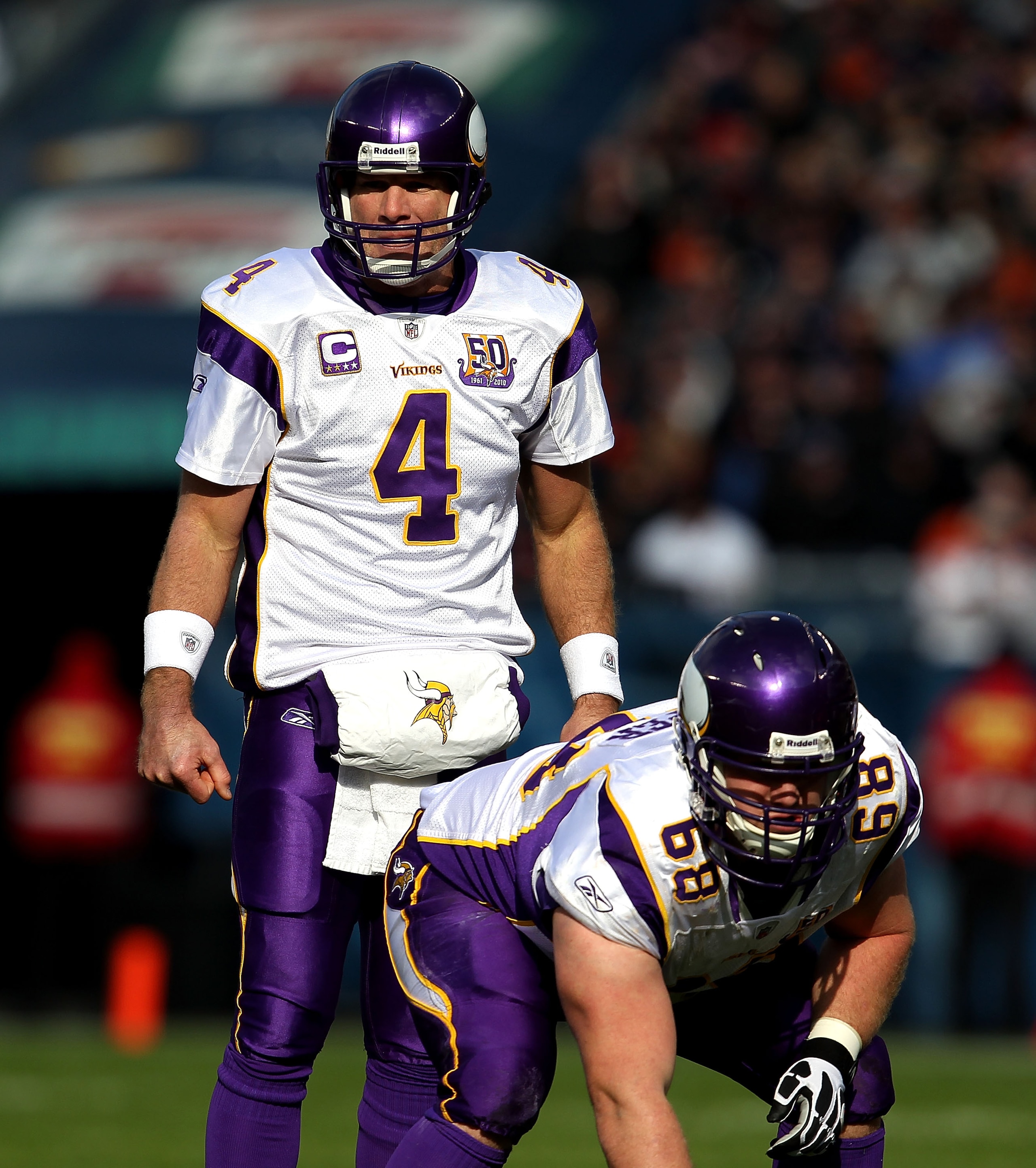 CHICAGO - NOVEMBER 14: Brett Favre #4 of the Minnesota Vikings looks over the Chicago Bear defense before taking the snap from Jon Cooper #68 at Soldier Field on November 14, 2010 in Chicago, Illinois. The Bears defeated the Vikings 27-13.  (Photo by Jona
