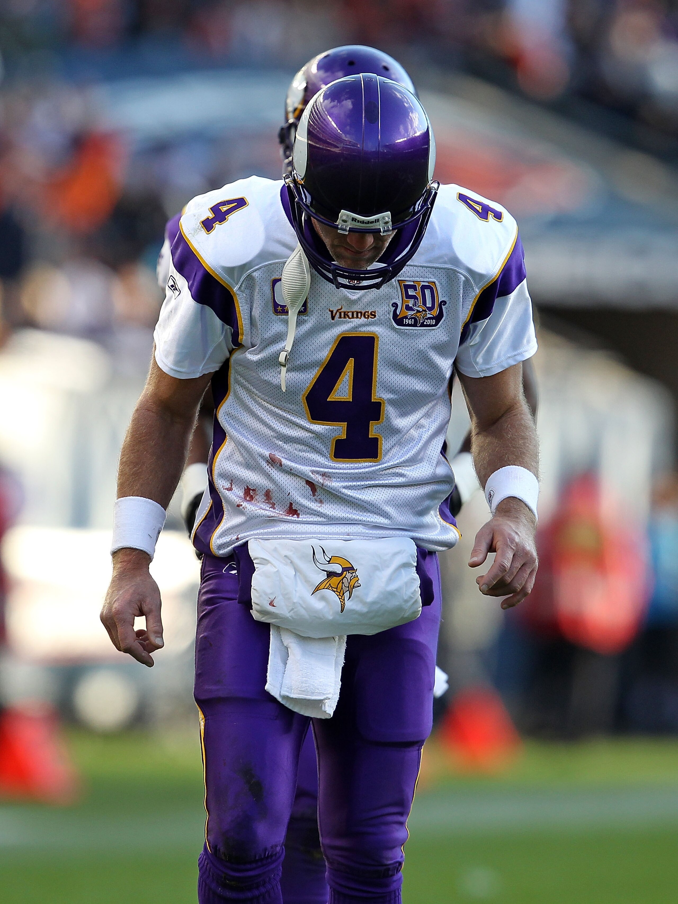 CHICAGO - NOVEMBER 14: Brett Favre #4 of the Minnesota Vikings walks back to the field of play from the sidelines during a game against the Chicago Bears at Soldier Field on November 14, 2010 in Chicago, Illinois. The Bears defeated the Vikings 27-13. (Ph