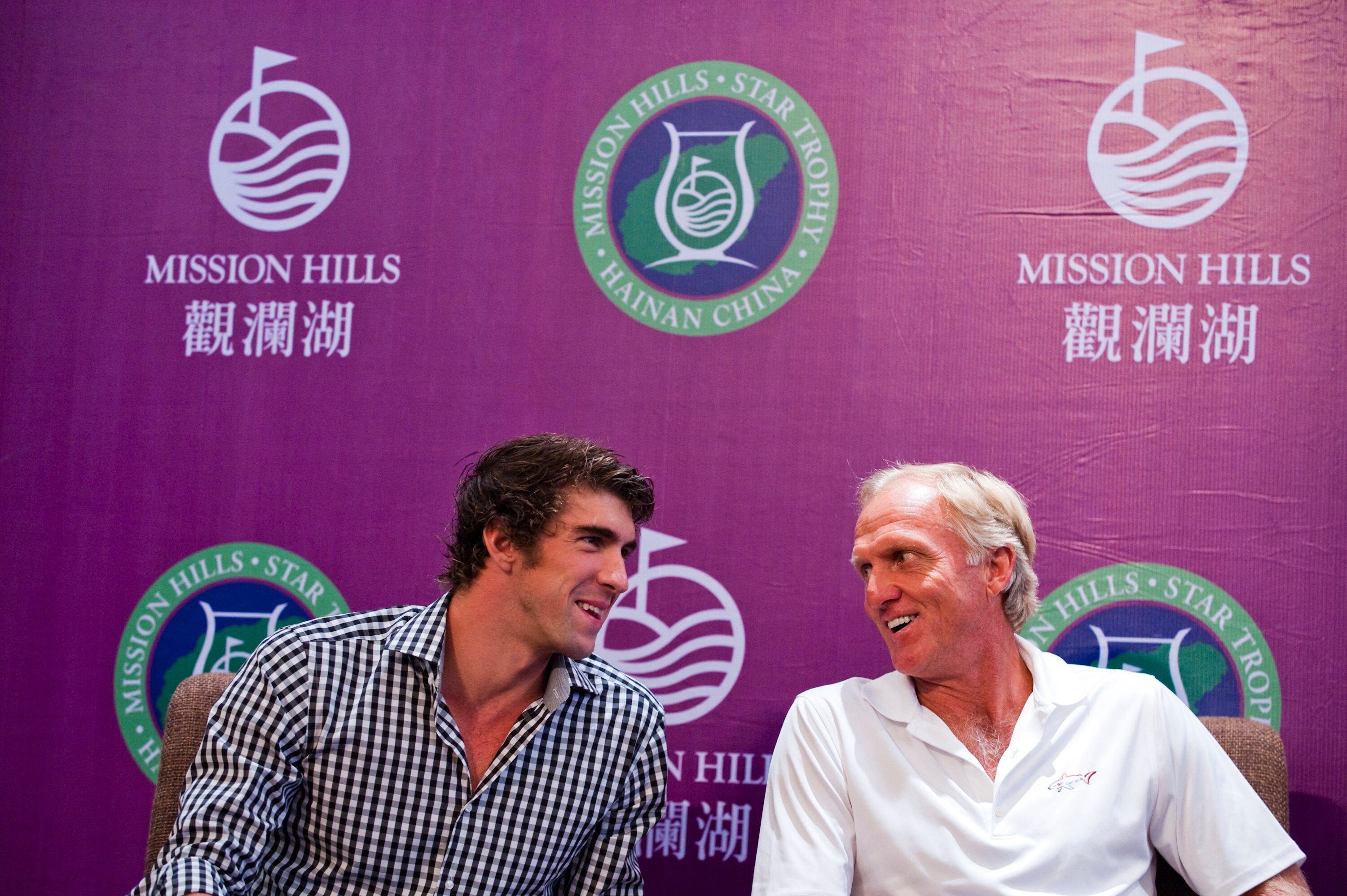 HAIKOU, CHINA - OCTOBER 27:  (L-R) Multiple Olympic gold medalist Michael Phelps of USA and golf legend Greg Norman of Australia attend the opening press conference of the Mission Hills Star Trophy on October 27, 2010 in Haikou, China. The Mission Hills S