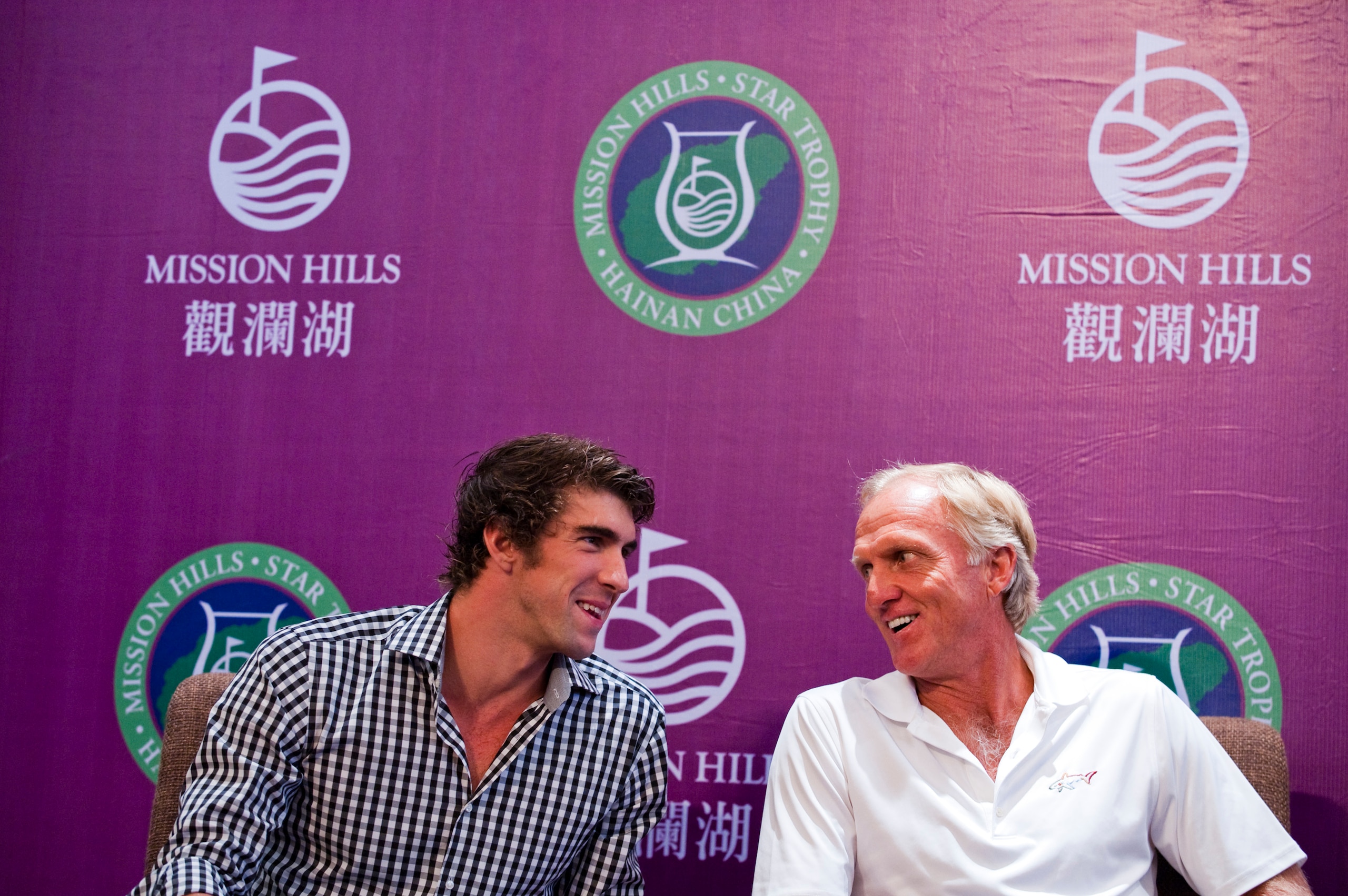 HAIKOU, CHINA - OCTOBER 27:  (L-R) Multiple Olympic gold medalist Michael Phelps of USA and golf legend Greg Norman of Australia attend the opening press conference of the Mission Hills Star Trophy on October 27, 2010 in Haikou, China. The Mission Hills S