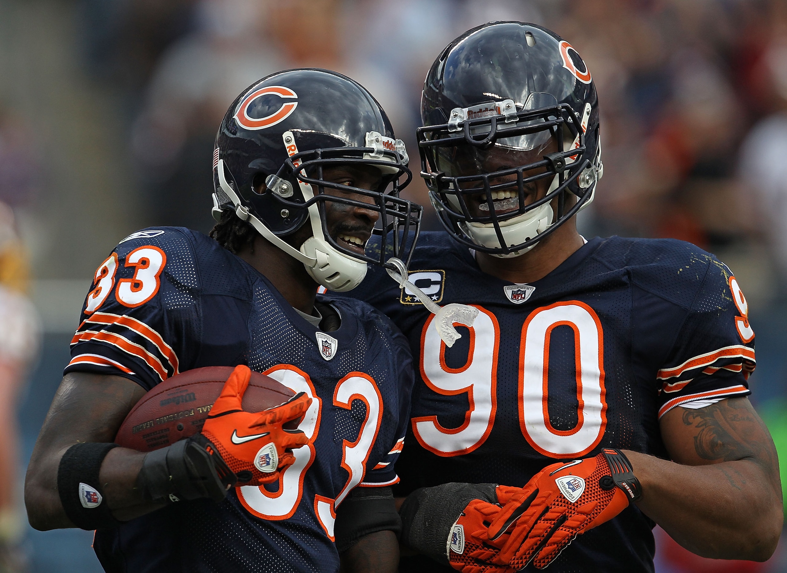 CHICAGO - OCTOBER 24: Charles Tillman #33 and Julius Peppers #90 celebrate a take-away by Tillman against the Chicago Bears of the Washington Redskins at Soldier Field on October 24, 2010 in Chicago, Illinois. The Redskins defeated the Bears 17-14. (Photo