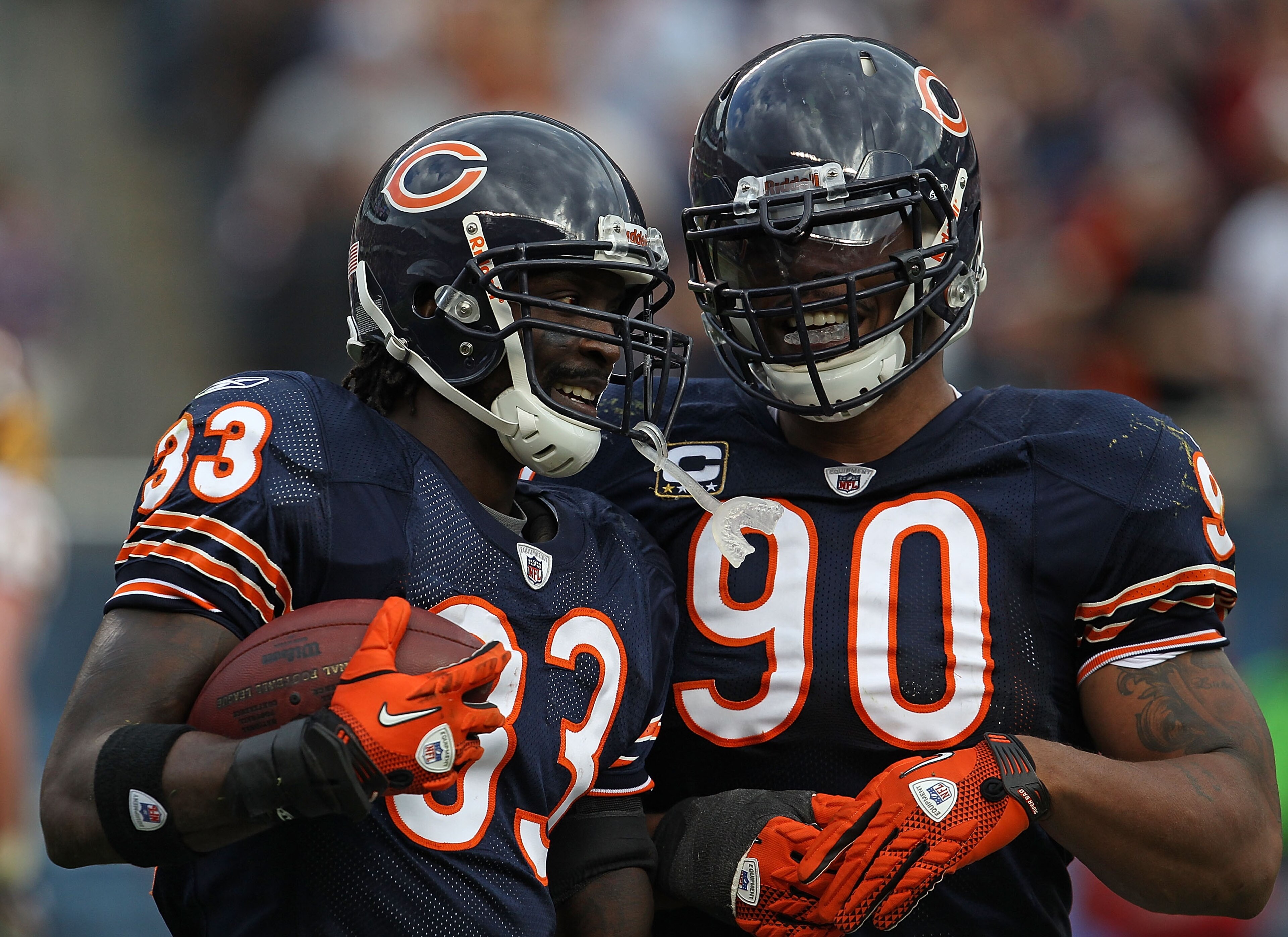 CHICAGO - OCTOBER 24: Charles Tillman #33 and Julius Peppers #90 celebrate a take-away by Tillman against the Chicago Bears of the Washington Redskins at Soldier Field on October 24, 2010 in Chicago, Illinois. The Redskins defeated the Bears 17-14. (Photo CHICAGO - OCTOBER 24: Charles Tillman #33 and Julius Peppers #90 celebrate a take-away by Tillman against the Chicago Bears of the Washington Redskins at Soldier Field on October 24, 2010 in Chicago, Illinois. The Redskins defeated the Bears 17-14. (Photo