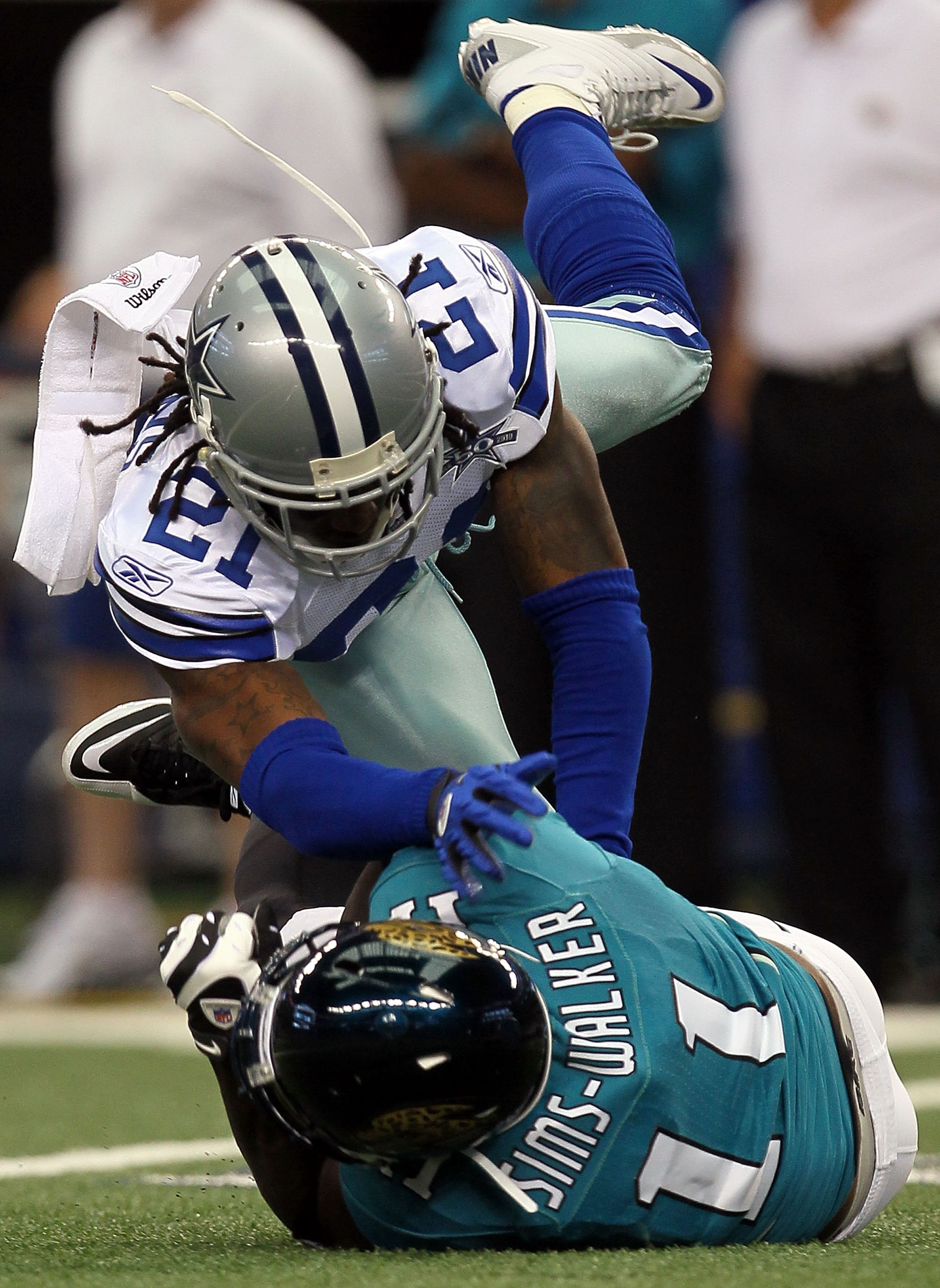 ARLINGTON, TX - OCTOBER 31: Wide receiver Mike Sims-Walker #11 of the Jacksonville Jaguars is tackled by Mike Jenkins #21 of the Dallas Cowboys at Cowboys Stadium on October 31, 2010 in Arlington, Texas. (Photo by Stephen Dunn/Getty Images) ARLINGTON, TX - OCTOBER 31: Wide receiver Mike Sims-Walker #11 of the Jacksonville Jaguars is tackled by Mike Jenkins #21 of the Dallas Cowboys at Cowboys Stadium on October 31, 2010 in Arlington, Texas. (Photo by Stephen Dunn/Getty Images)